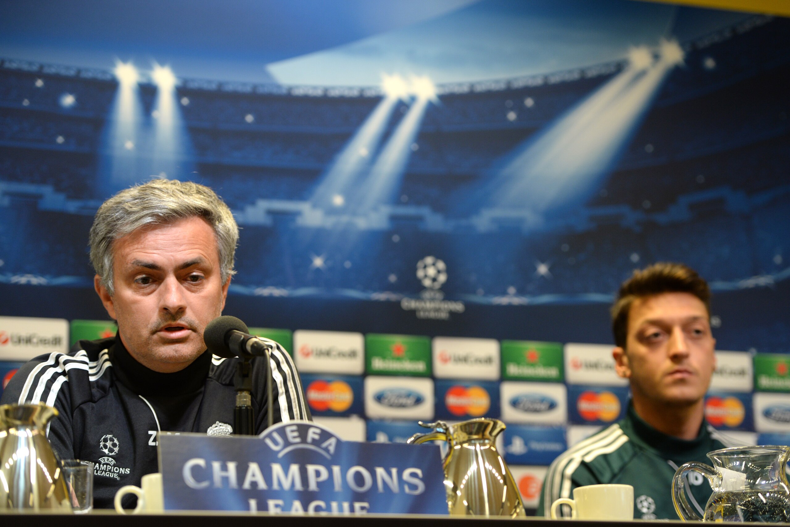 Madrid´s Portuguese head coach Jose Morinho and Madrid 's German midfielder Mesut Oezil attend a press conference in Dortmund, western Germany on April 23, 2013, on the eve of the UEFA Champions League football match against Borussia Dortmund. AFP PHOTO /