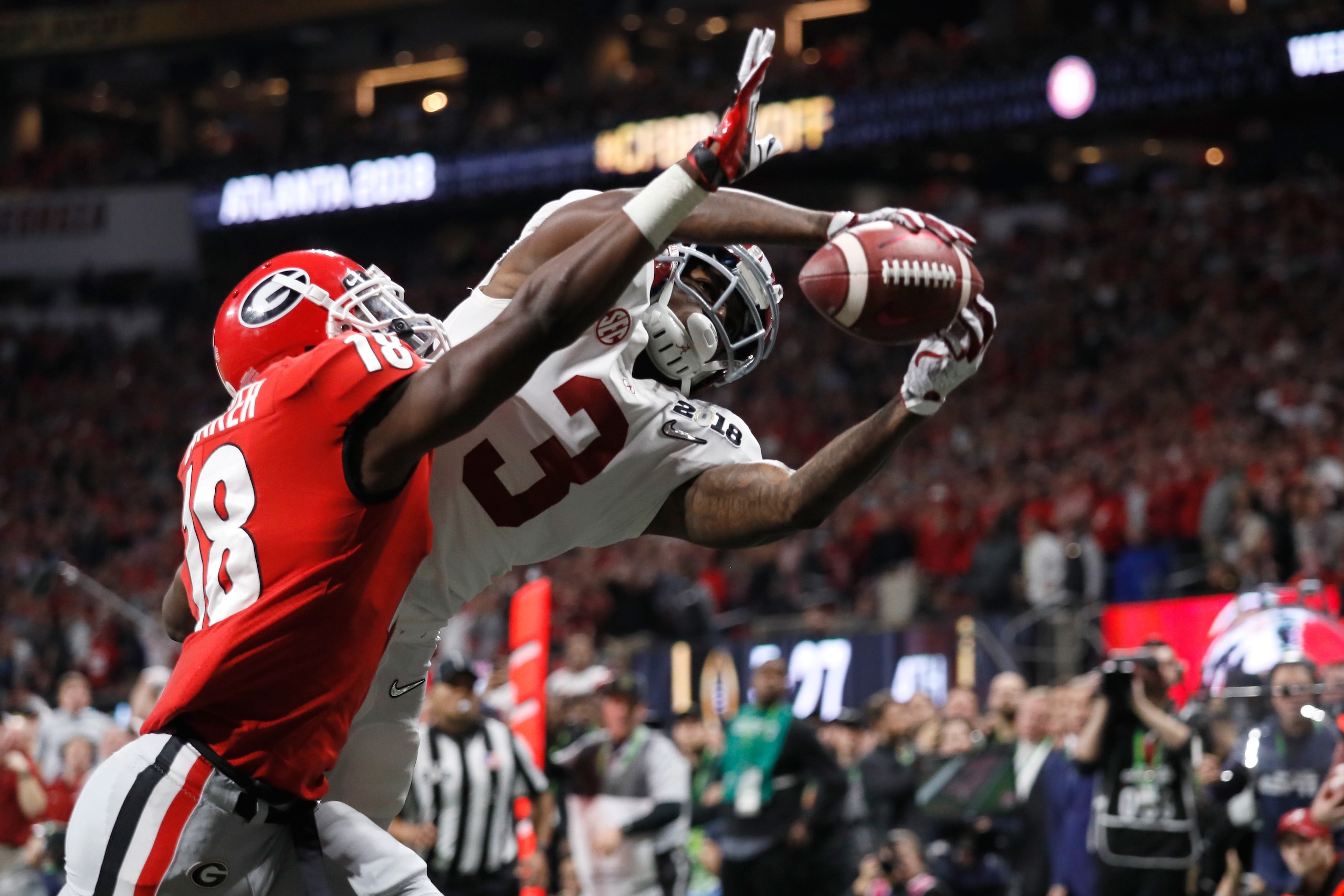 ATLANTA, GA - JANUARY 08: Calvin Ridley #3 of the Alabama Crimson Tide fails to make a catch against Deandre Baker #18 of the Georgia Bulldogs during the second half in the CFP National Championship presented by AT&T at Mercedes-Benz Stadium on January 8,