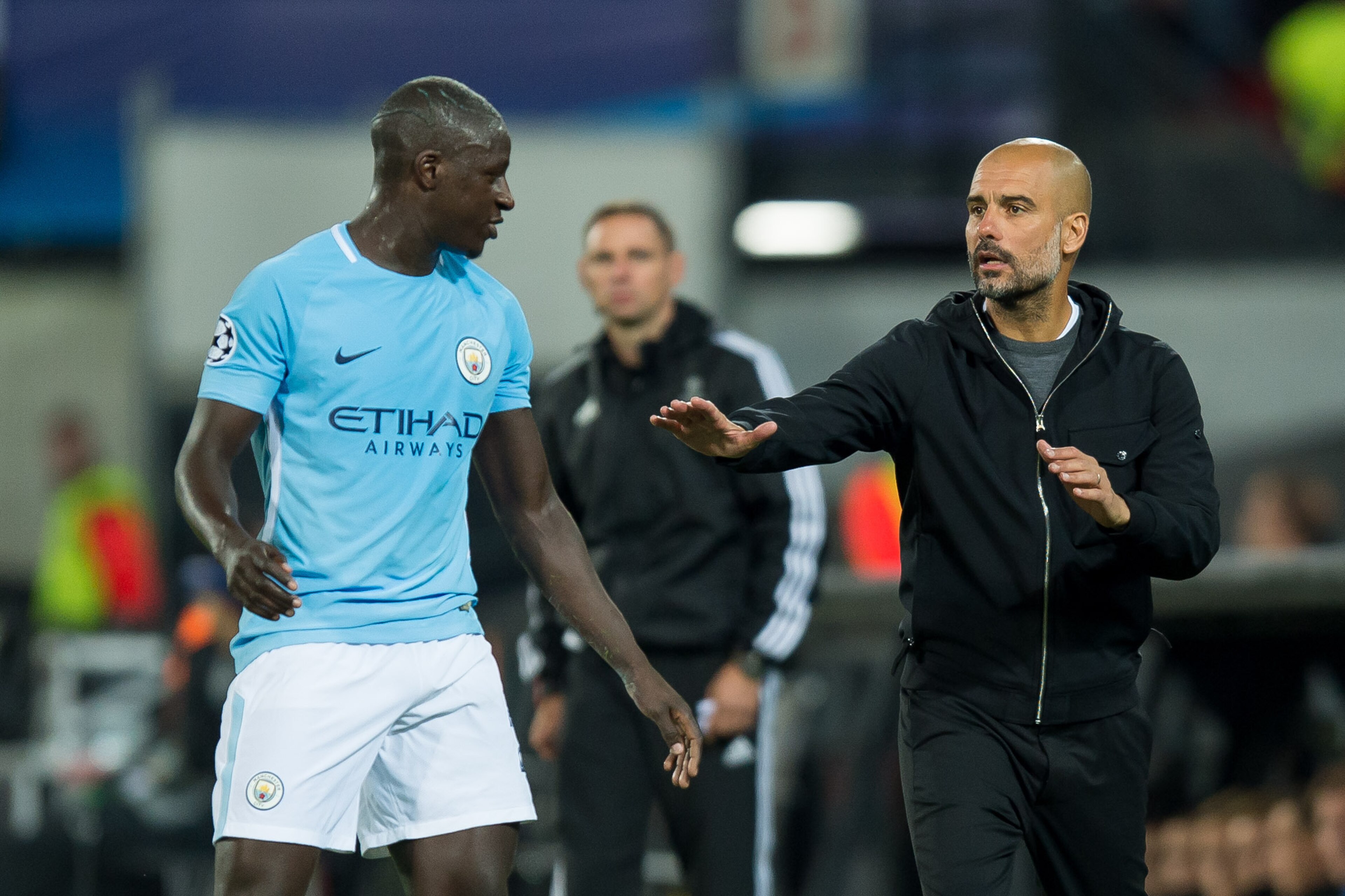 ROTTERDAM, NETHERLANDS - SEPTEMBER 13: Benjamin Mendy of Manchester City and Head coach Pep Guardiola of Manchester City looks on during the UEFA Champions League match between Feyenoord Rotterdam and Manchester City at Stadion Feijenoord on September 13,