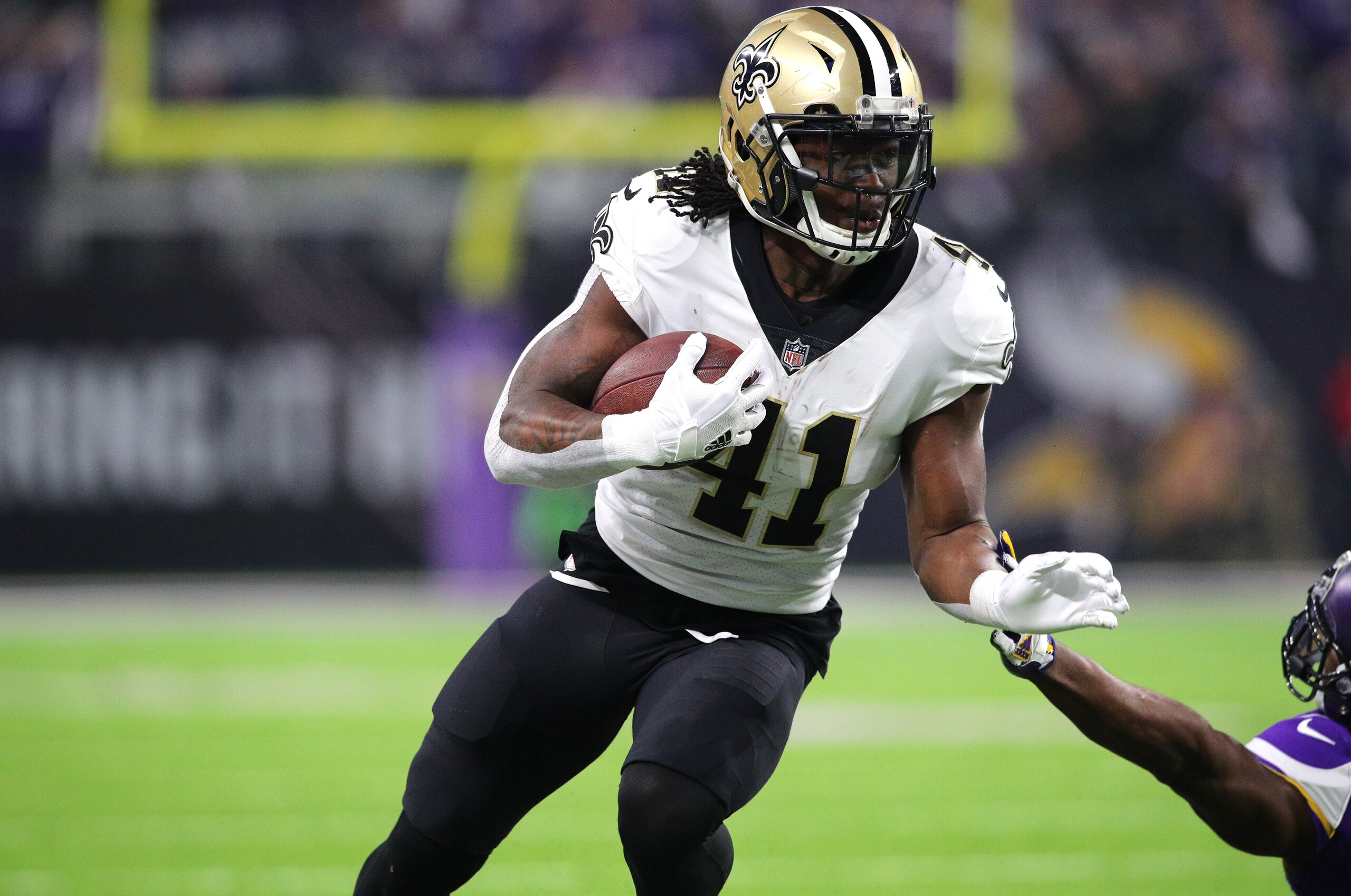 MINNEAPOLIS, MN - JANUARY 14:  Alvin Kamara #41 of the New Orleans Saints carries the ball in the second quarter of the NFC Divisional Playoff game against the Minnesota Viking on January 14, 2018 at U.S. Bank Stadium in Minneapolis, Minnesota. (Photo by 