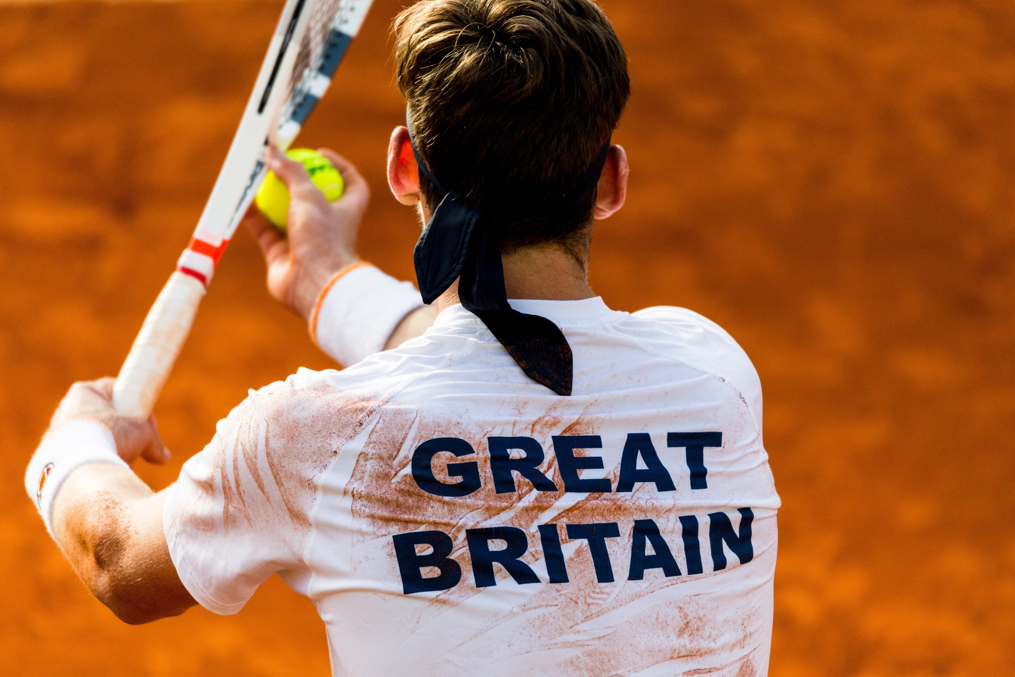 MARBELLA, SPAIN - FEBRUARY 01:  Cameron Norrie of Great Britain prepares to serve during practice ahead of the Davis Cup by BNP Paribas World Group First Round match between Spain and Great Britain on February 1, 2018 in Marbella, Spain.  (Photo by Getty 