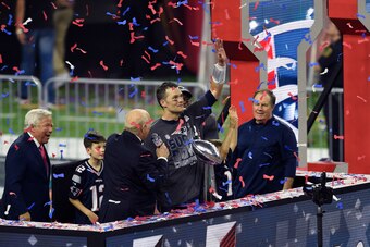 HOUSTON, TX - FEBRUARY 05: Tom Brady #12 of the New England Patriots celebrates with the Vince Lombardi trophy after the Patriots defeat the Atlanta Falcons 34-28 in overtime of Super Bowl 51 at NRG Stadium on February 5, 2017 in Houston, Texas. (Photo by