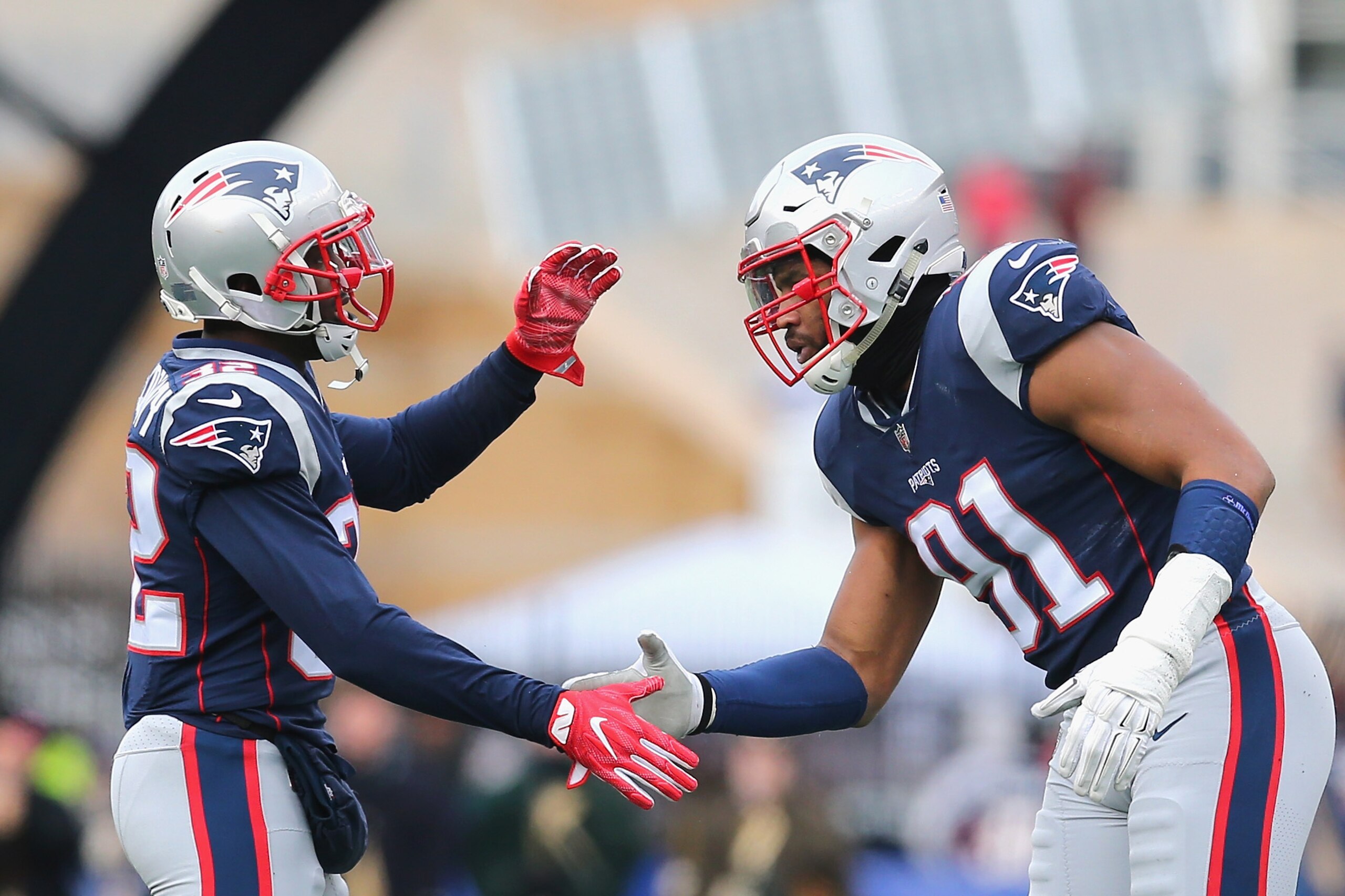 FOXBORO, MA - DECEMBER 24: Devin McCourty #32 of the New England Patriots high fives Deatrich Wise Jr. #91 during the first quarter of a game against the Buffalo Bills at Gillette Stadium on December 24, 2017 in Foxboro, Massachusetts. (Photo by Maddie M FOXBORO, MA - DECEMBER 24: Devin McCourty #32 of the New England Patriots high fives Deatrich Wise Jr. #91 during the first quarter of a game against the Buffalo Bills at Gillette Stadium on December 24, 2017 in Foxboro, Massachusetts. (Photo by Maddie M