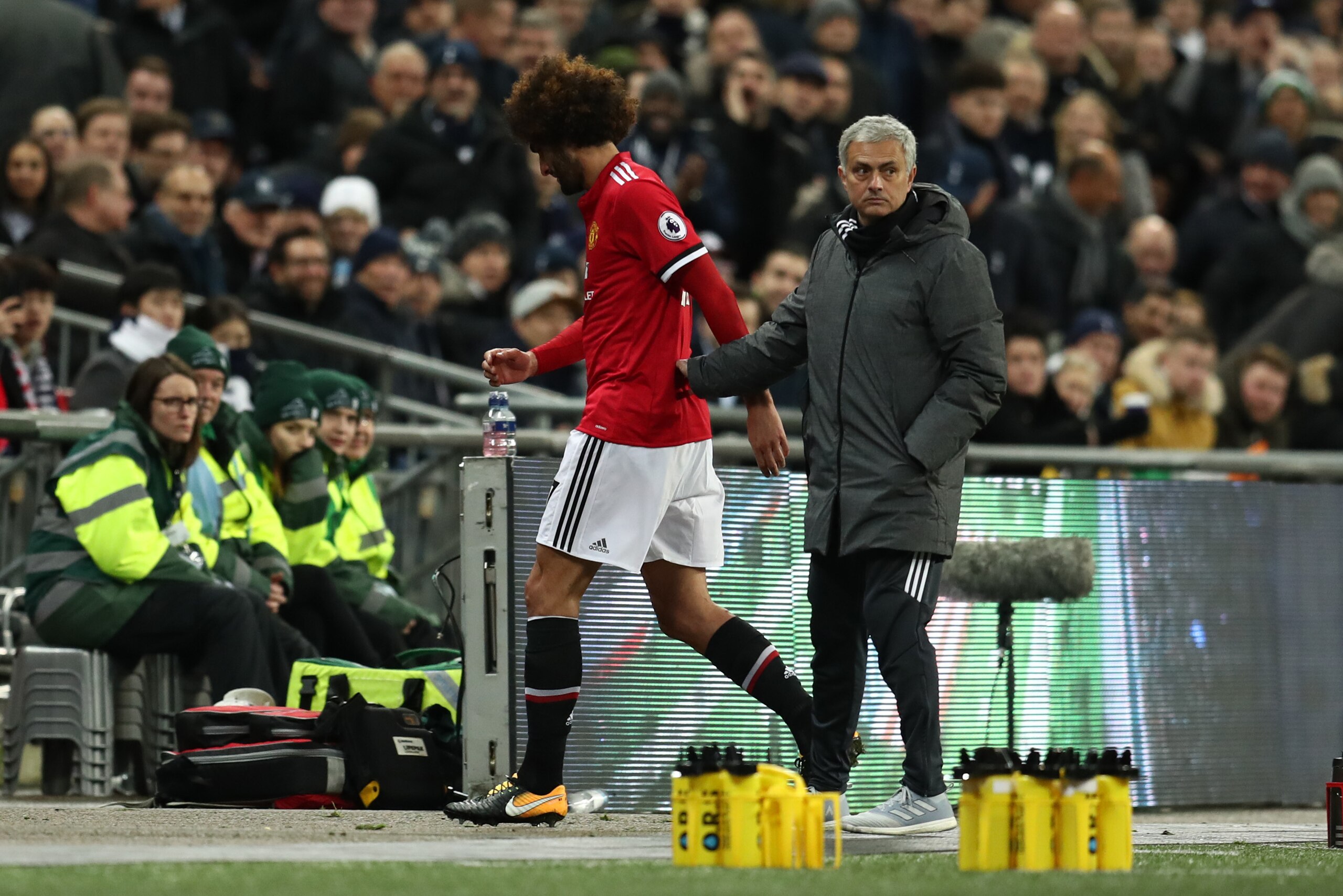 LONDON, ENGLAND - JANUARY 31: Jose Mourinho the head coach / manager of Manchester United with Marouane Fellaini of Manchester United as he is substituted during the Premier League match between Tottenham Hotspur and Manchester United at Wembley Stadium o