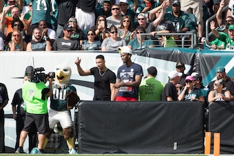 PHILADELPHIA, PA - SEPTEMBER 11: Philadelphia 76ers players Ben Simmons and Joel Embiid wave to the crowd during the game between the Cleveland Browns and Philadelphia Eagles at Lincoln Financial Field on September 11, 2016 in Philadelphia, Pennsylvania. 