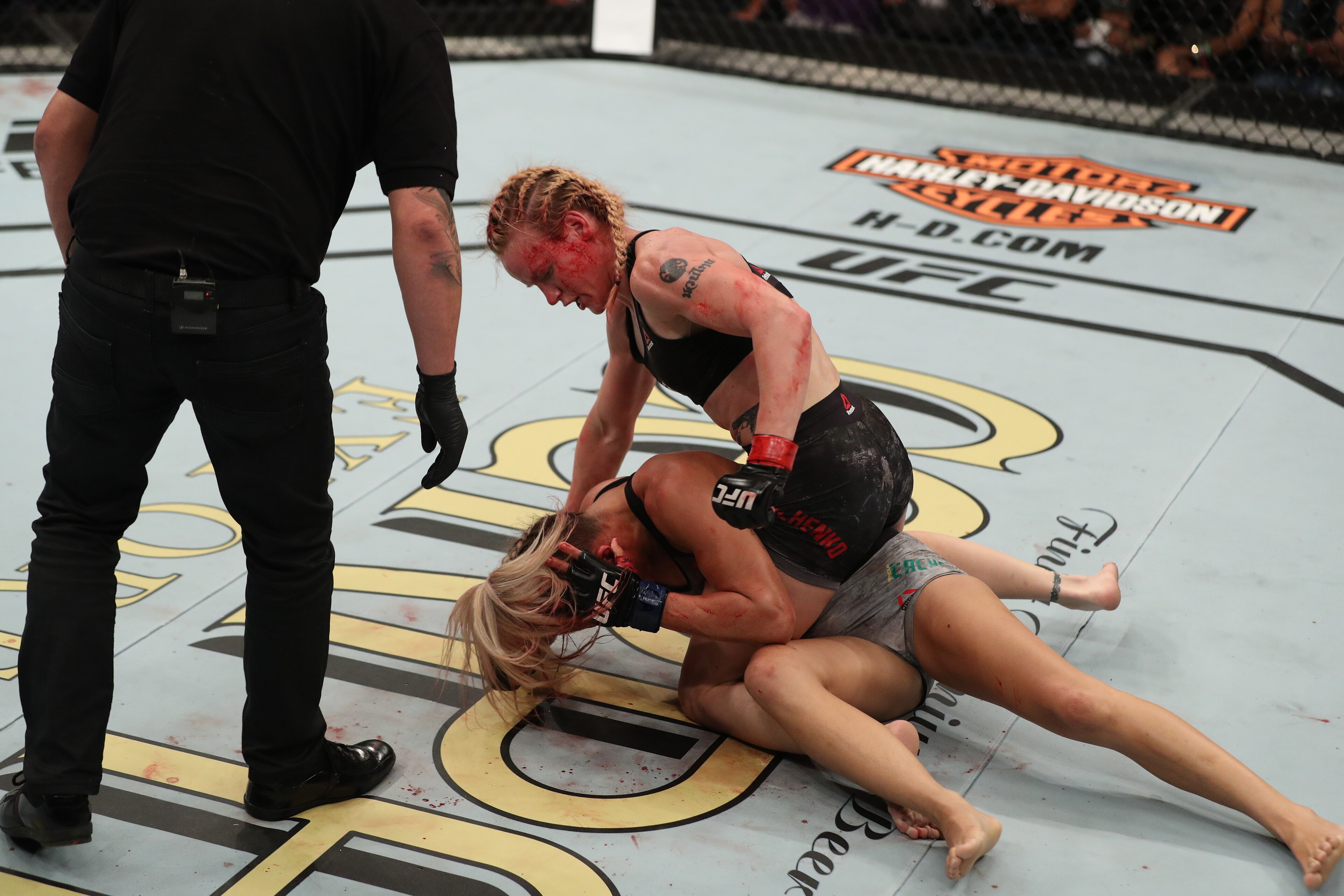 BELEM, BRAZIL - FEBRUARY 03:  Valentina Shevchenko of Kyrgyzstan (top) punches Priscila Cachoeira of Brazil in their women's flyweight bout during the UFC Fight Night event at Mangueirinho Arena on February 03, 2018 in Belem, Brazil. (Photo by Buda Mendes