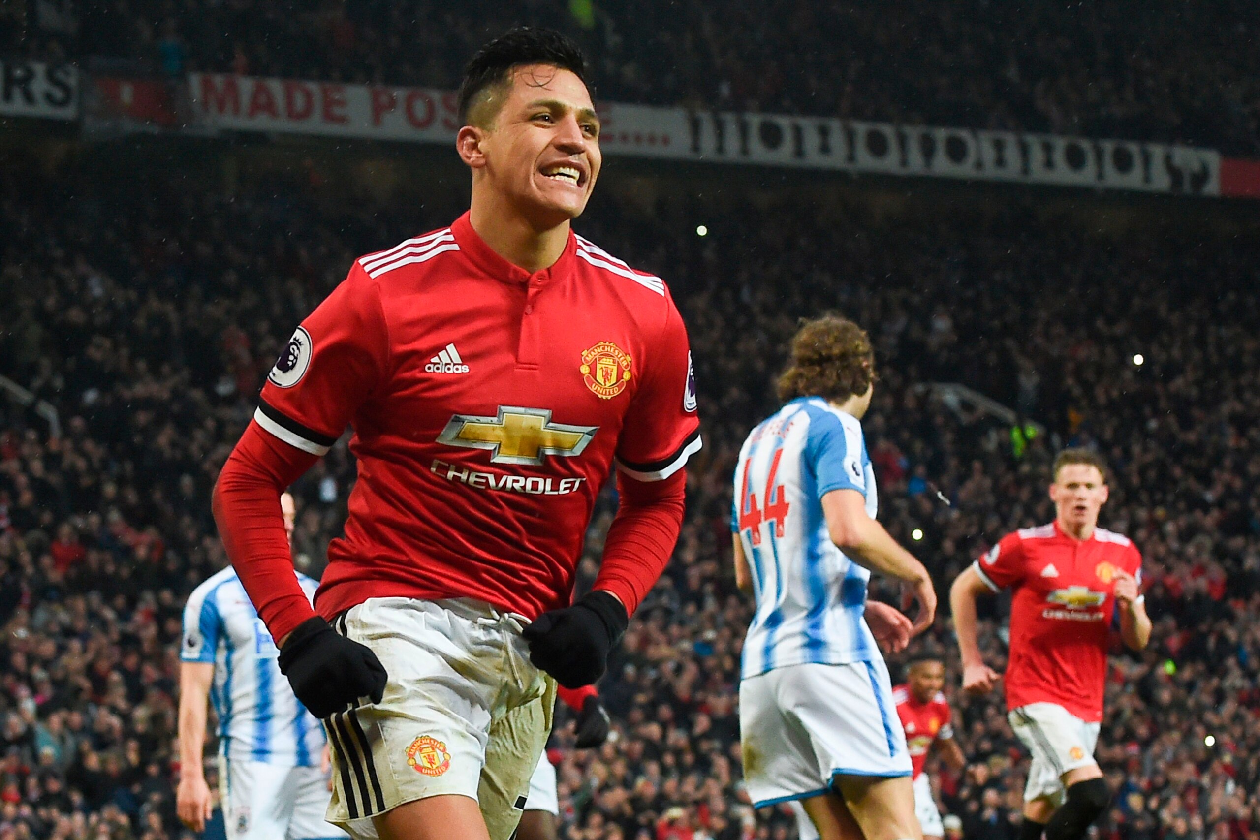 Manchester United's Chilean striker Alexis Sanchez celebrates scoring their second goal during the English Premier League football match between Manchester United and Huddersfield Town at Old Trafford in Manchester, north west England, on February 3, 2018 Manchester United's Chilean striker Alexis Sanchez celebrates scoring their second goal during the English Premier League football match between Manchester United and Huddersfield Town at Old Trafford in Manchester, north west England, on February 3, 2018