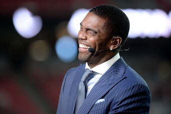 GLENDALE, AZ - SEPTEMBER 25:  ESPN analysts Randy Moss smiles on set during the MNF broadcast prior to the NFL game between the Dallas Cowboys and Arizona Cardinals at University of Phoenix Stadium on September 25, 2017 in Glendale, Arizona.  (Photo by Je