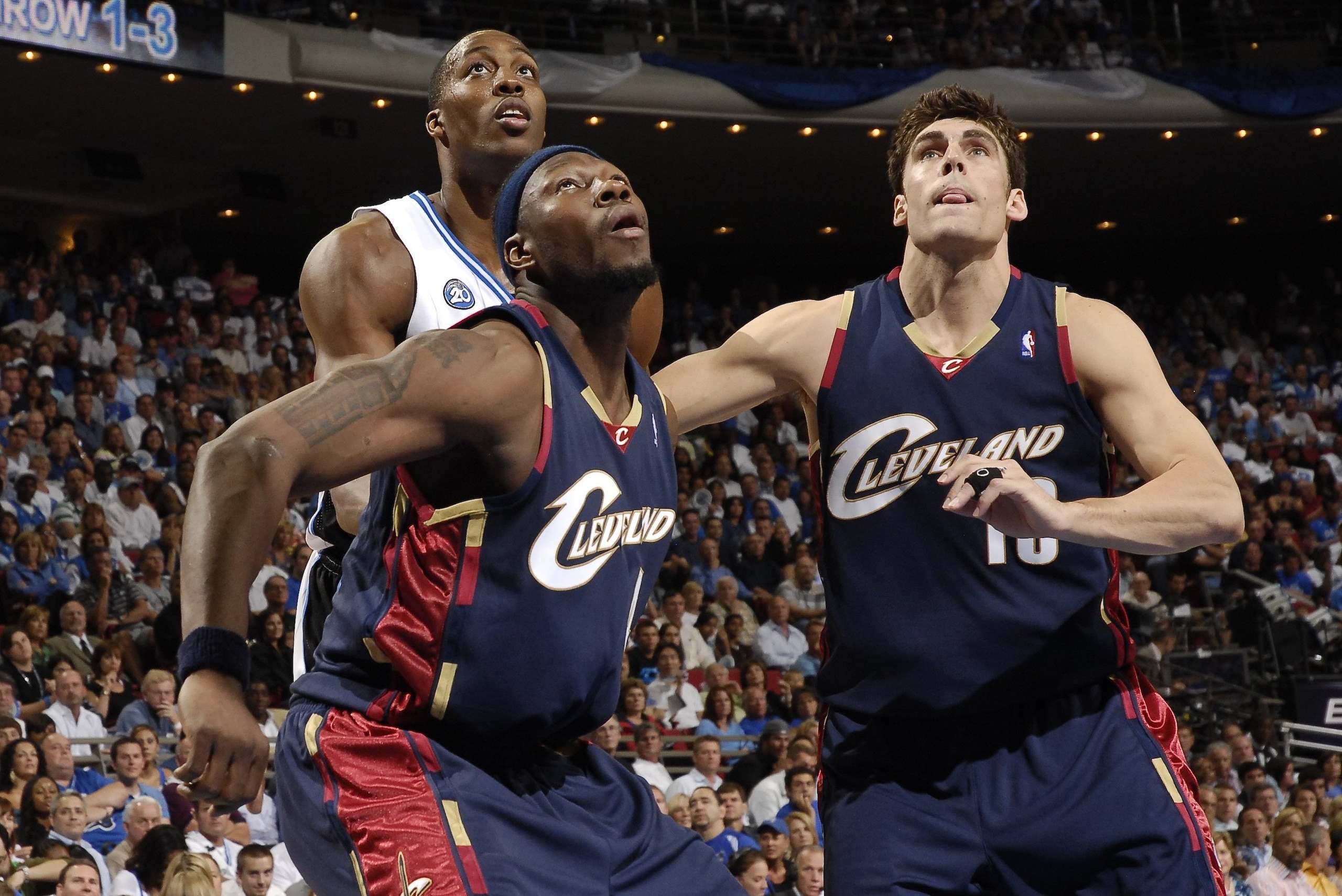ORLANDO - MAY 26: Dwight Howard #12 of the Orlando Magic battles for position with Ben Wallace #4 and Wally Szczerbiak #10 of the Cleveland Cavaliers in Game Four of the Eastern Conference Finals during the 2009 NBA Playoffs at Amway Arena on May 26, 2009