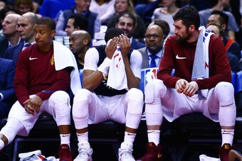 TORONTO, ON - JANUARY 11:  Isaiah Thomas #3, Dwayne Wade #9 and Kevin Love #0 of the Cleveland Cavaliers look on from the bench during the second half of an NBA game against the Toronto Raptors at Air Canada Centre on January 11, 2018 in Toronto, Canada. 