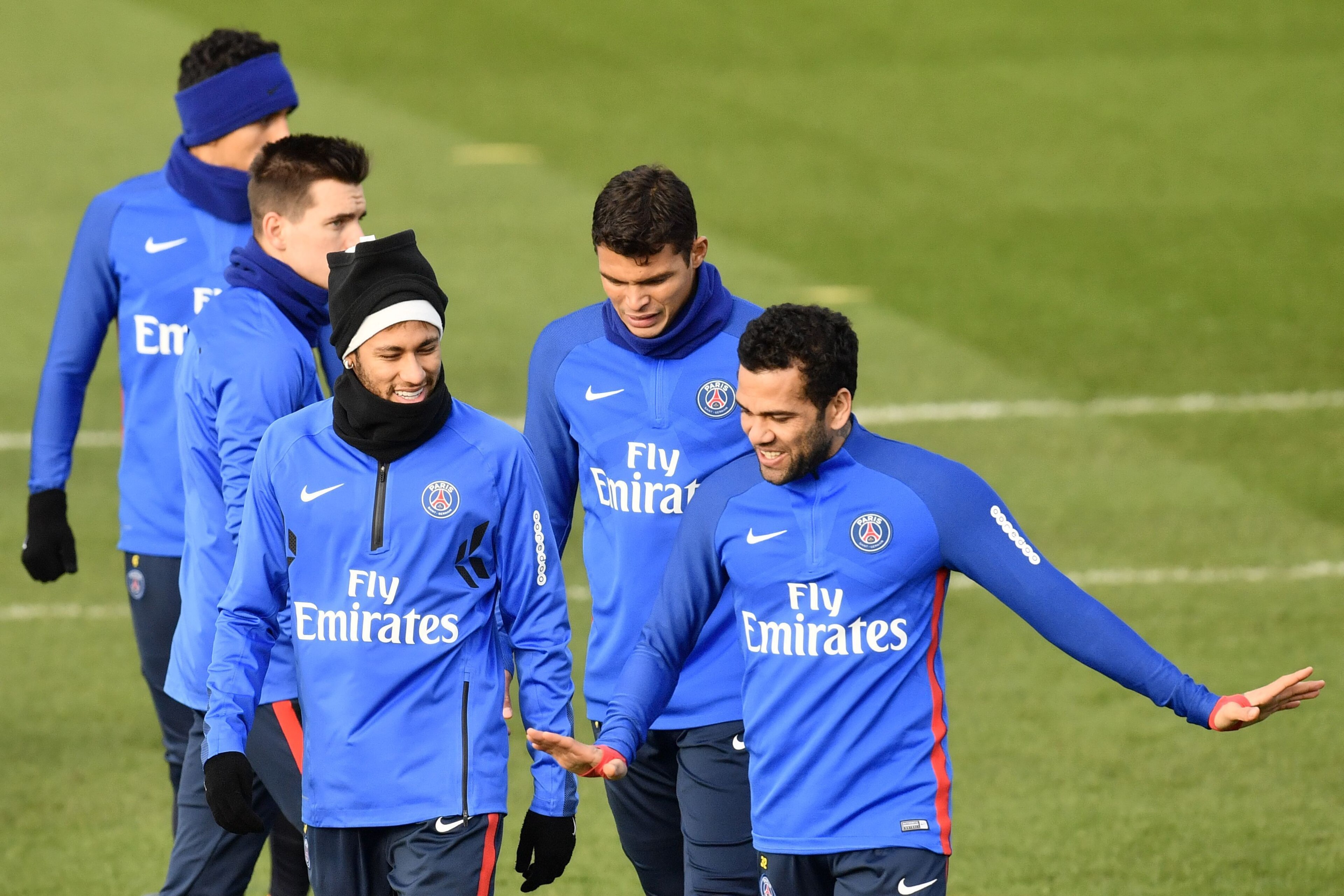 Paris Saint-Germain's Brazilian forward Neymar (L), Paris Saint-Germain's Brazilian defender Thiago Silva (C) and Paris Saint-Germain's Brazilian defender Dani Alves (R) take part in a training session of the Paris Saint-Germain football team in Saint-Ger Paris Saint-Germain's Brazilian forward Neymar (L), Paris Saint-Germain's Brazilian defender Thiago Silva (C) and Paris Saint-Germain's Brazilian defender Dani Alves (R) take part in a training session of the Paris Saint-Germain football team in Saint-Ger