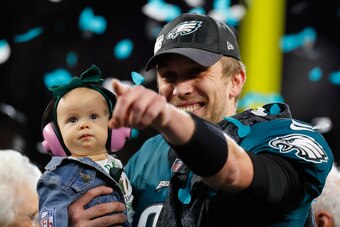 MINNEAPOLIS, MN - FEBRUARY 04:  Nick Foles #9 of the Philadelphia Eagles celebrates with his daughter Lily Foles after his 41-33 victory over the New England Patriots in Super Bowl LII at U.S. Bank Stadium on February 4, 2018 in Minneapolis, Minnesota. Th