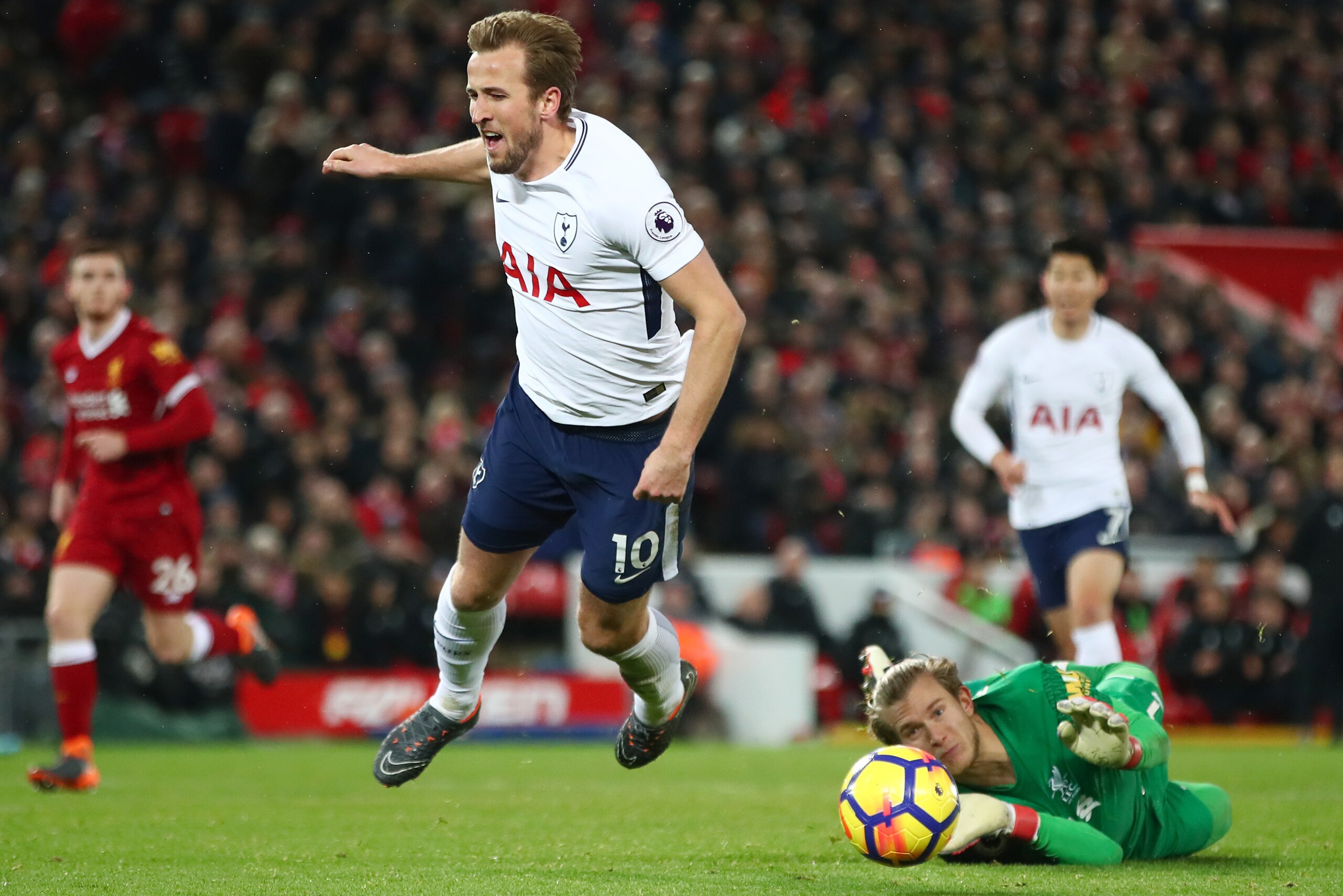 LIVERPOOL, ENGLAND - FEBRUARY 04: Loris Karius of Liverpool fouls Harry Kane of Tottenham Hotspur and a penalty is awarded during the Premier League match between Liverpool and Tottenham Hotspur at Anfield on February 4, 2018 in Liverpool, England. (Phot LIVERPOOL, ENGLAND - FEBRUARY 04: Loris Karius of Liverpool fouls Harry Kane of Tottenham Hotspur and a penalty is awarded during the Premier League match between Liverpool and Tottenham Hotspur at Anfield on February 4, 2018 in Liverpool, England. (Phot