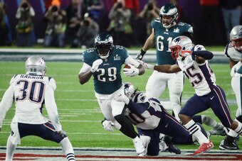 MINNEAPOLIS, MN - FEBRUARY 04:  LeGarrette Blount #29 of the Philadelphia Eagles carries the ball defended by Malcom Brown #90 of the New England Patriots in the third quarter of Super Bowl LII at U.S. Bank Stadium on February 4, 2018 in Minneapolis, Minn