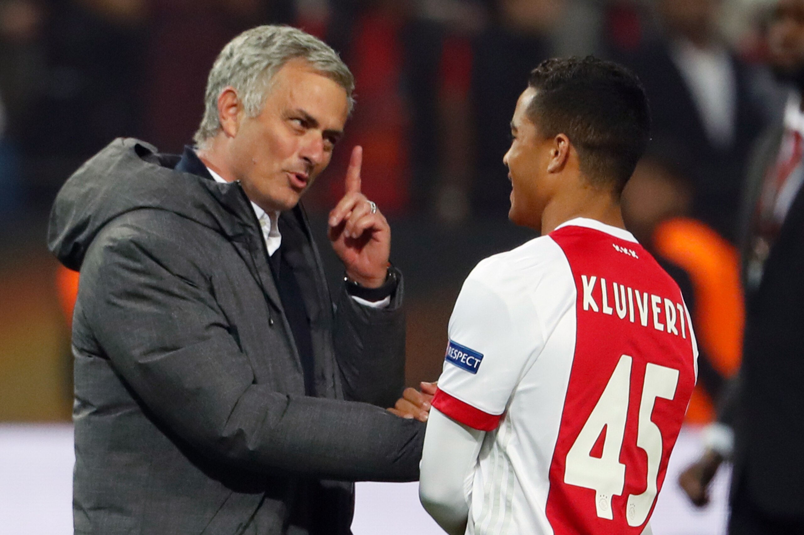 Manchester United's Portuguese manager Jose Mourinho (L) spaeks with Ajax Dutch forward Justin Kluivert after the UEFA Europa League final football match Ajax Amsterdam v Manchester United on May 24, 2017 at the Friends Arena in Solna outside Stockholm. /
