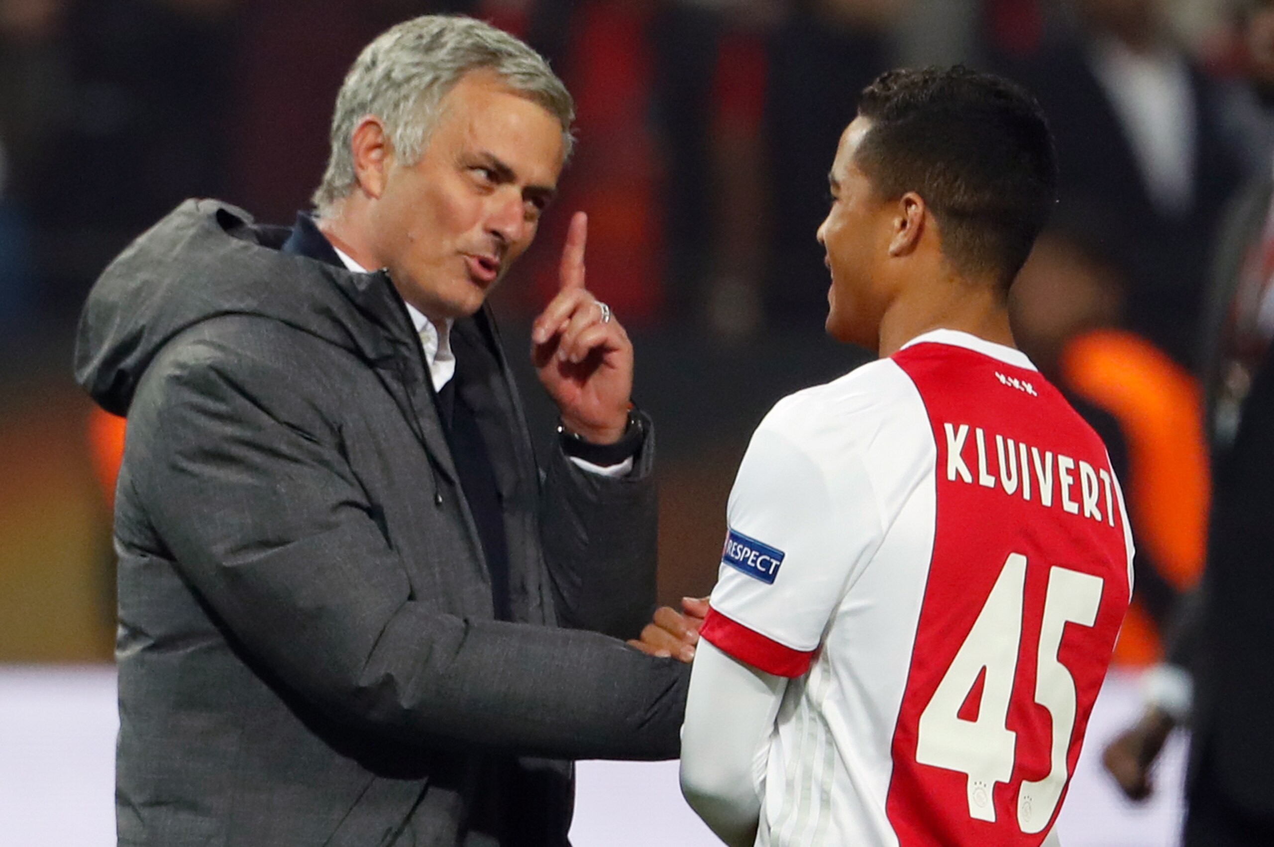 Manchester United's Portuguese manager Jose Mourinho (L) spaeks with Ajax Dutch forward Justin Kluivert after the UEFA Europa League final football match Ajax Amsterdam v Manchester United on May 24, 2017 at the Friends Arena in Solna outside Stockholm. /