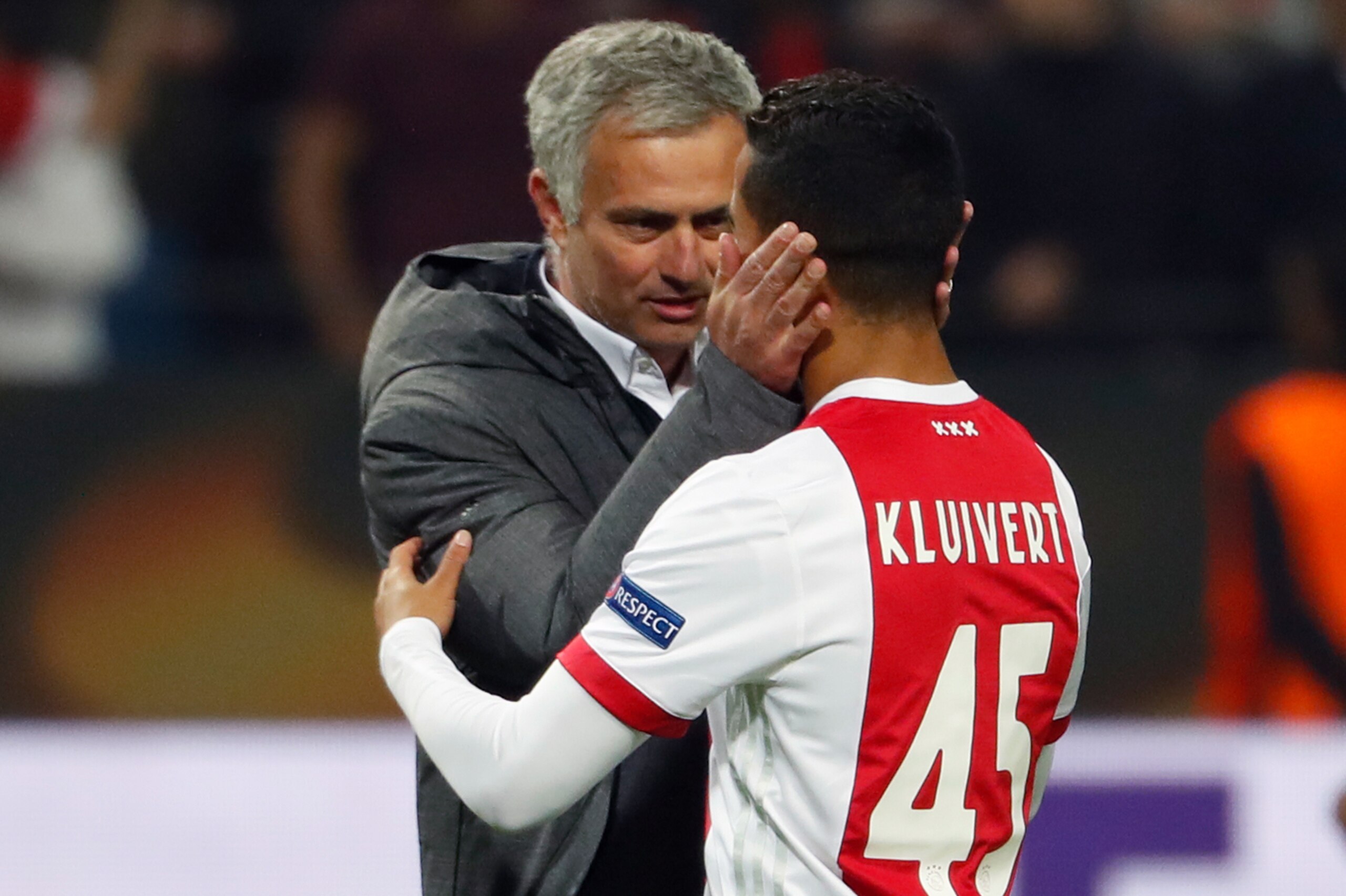 Manchester United's Portuguese manager Jose Mourinho (L) spaeks with Ajax Dutch forward Justin Kluivert after the UEFA Europa League final football match Ajax Amsterdam v Manchester United on May 24, 2017 at the Friends Arena in Solna outside Stockholm.  