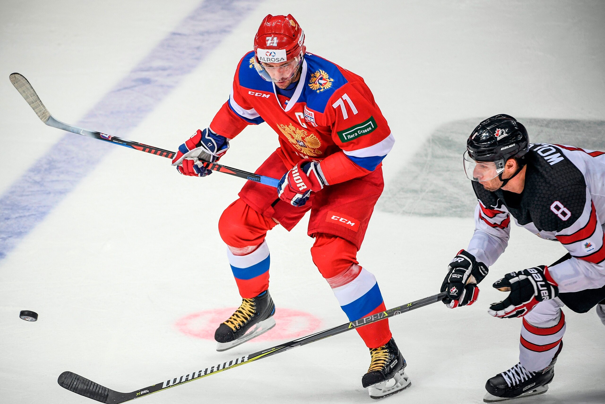Russia's forward Ilya Kovalchuk (L) vies for the puck with Canada's forward Wojtek Wolski during the Channel One Cup of the Euro Hockey Tour ice hockey match between Canada and Russia in Moscow on December 16, 2017.
 / AFP PHOTO / Alexander NEMENOV       