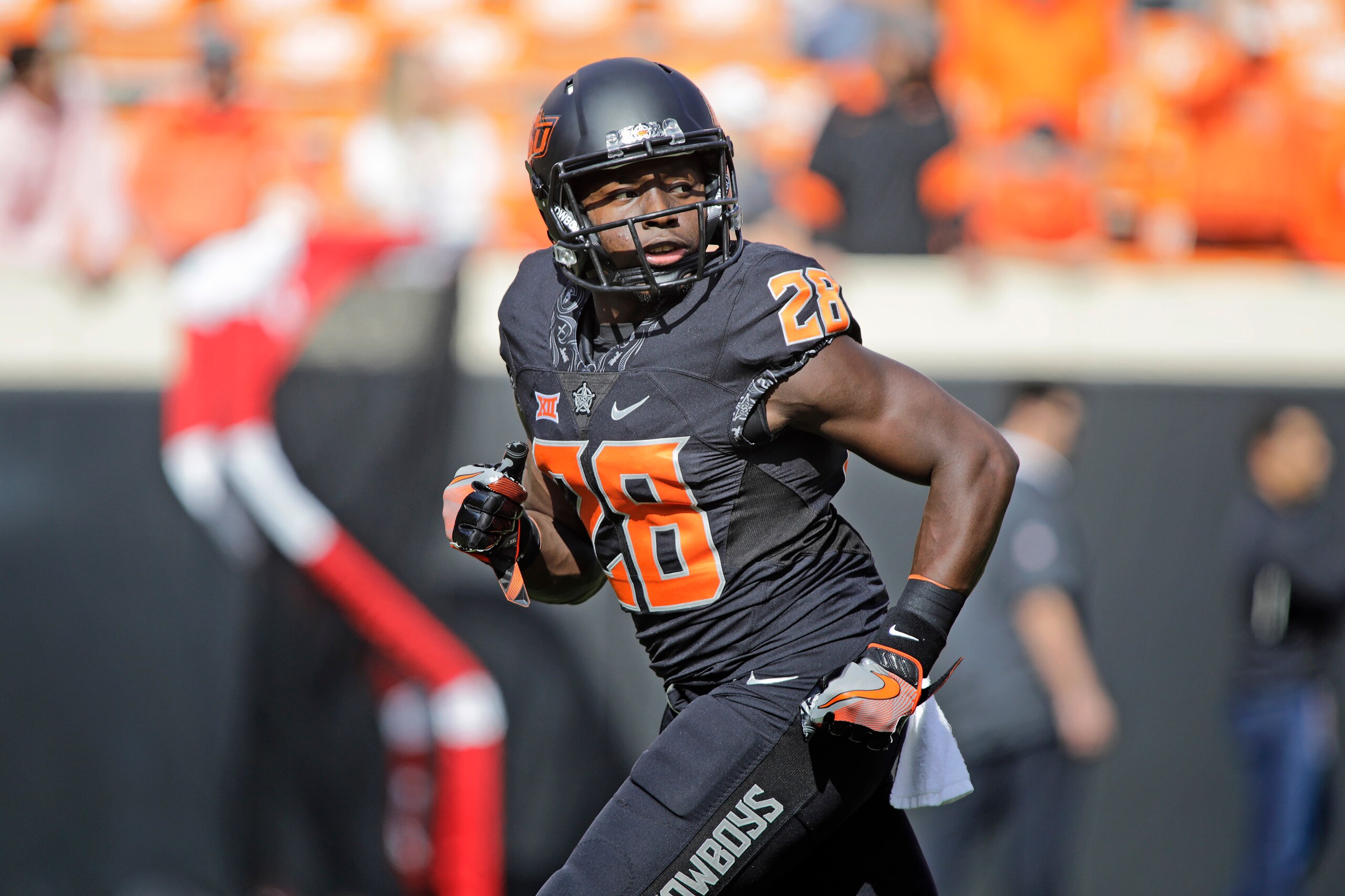 STILLWATER, OK - NOVEMBER 04: Wide receiver James Washington #28 of the Oklahoma State Cowboys warms up before the game against the Oklahoma Sooners at Boone Pickens Stadium on November 4, 2017 in Stillwater, Oklahoma. Oklahoma defeated Oklahoma State 62-