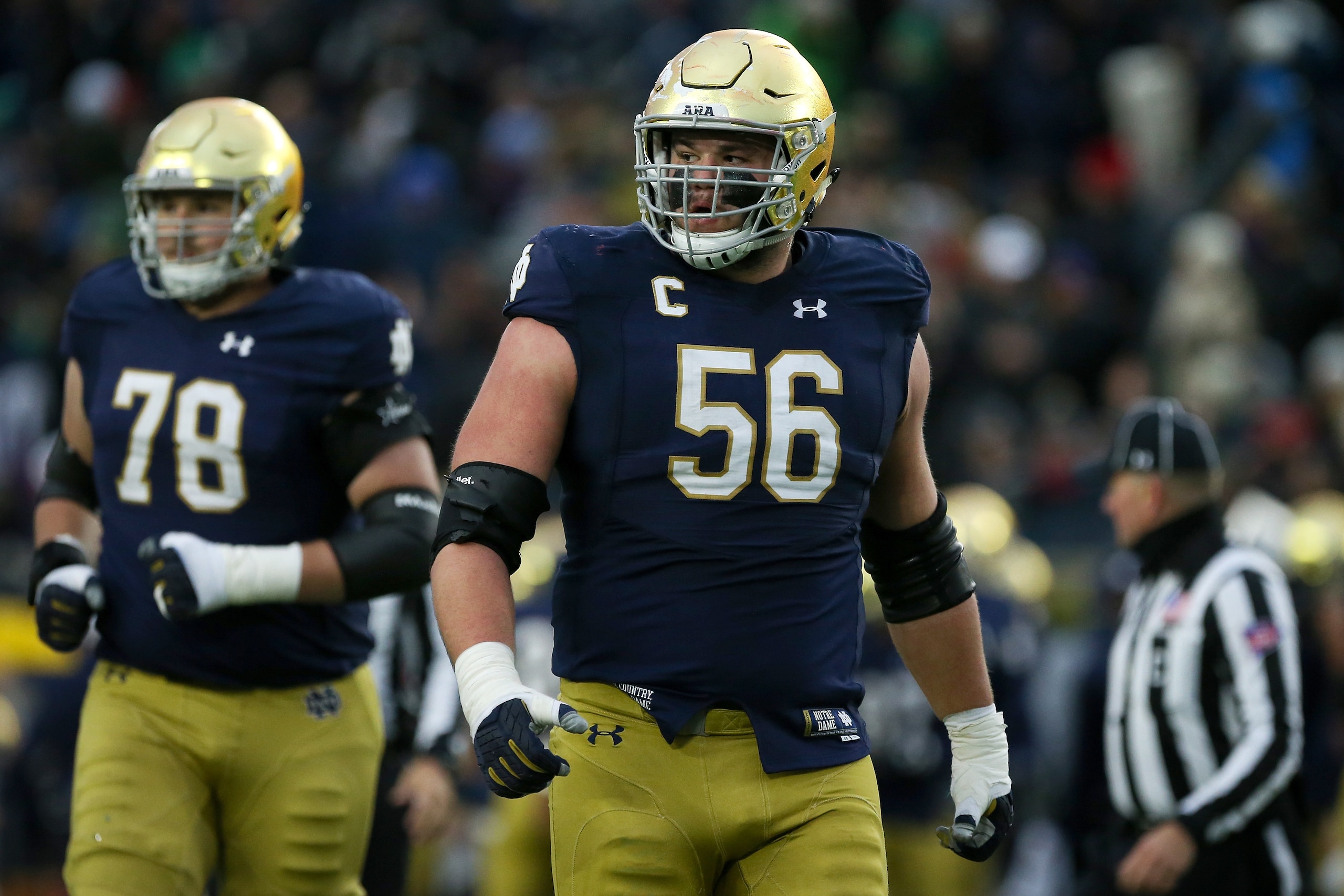 SOUTH BEND, IN - OCTOBER 28:  Quenton Nelson #56 of the Notre Dame Fighting Irish walks across the field in the second quarter against the North Carolina State Wolfpack at Notre Dame Stadium on October 28, 2017 in South Bend, Indiana. (Photo by Dylan Buel