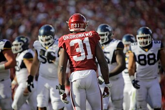 NORMAN, OK - NOVEMBER 25: Defensive end Ogbonnia Okoronkwo #31 of the Oklahoma Sooners lines up before a play against the West Virginia Mountaineers at Gaylord Family Oklahoma Memorial Stadium on November 25, 2017 in Norman, Oklahoma. Oklahoma defeated We