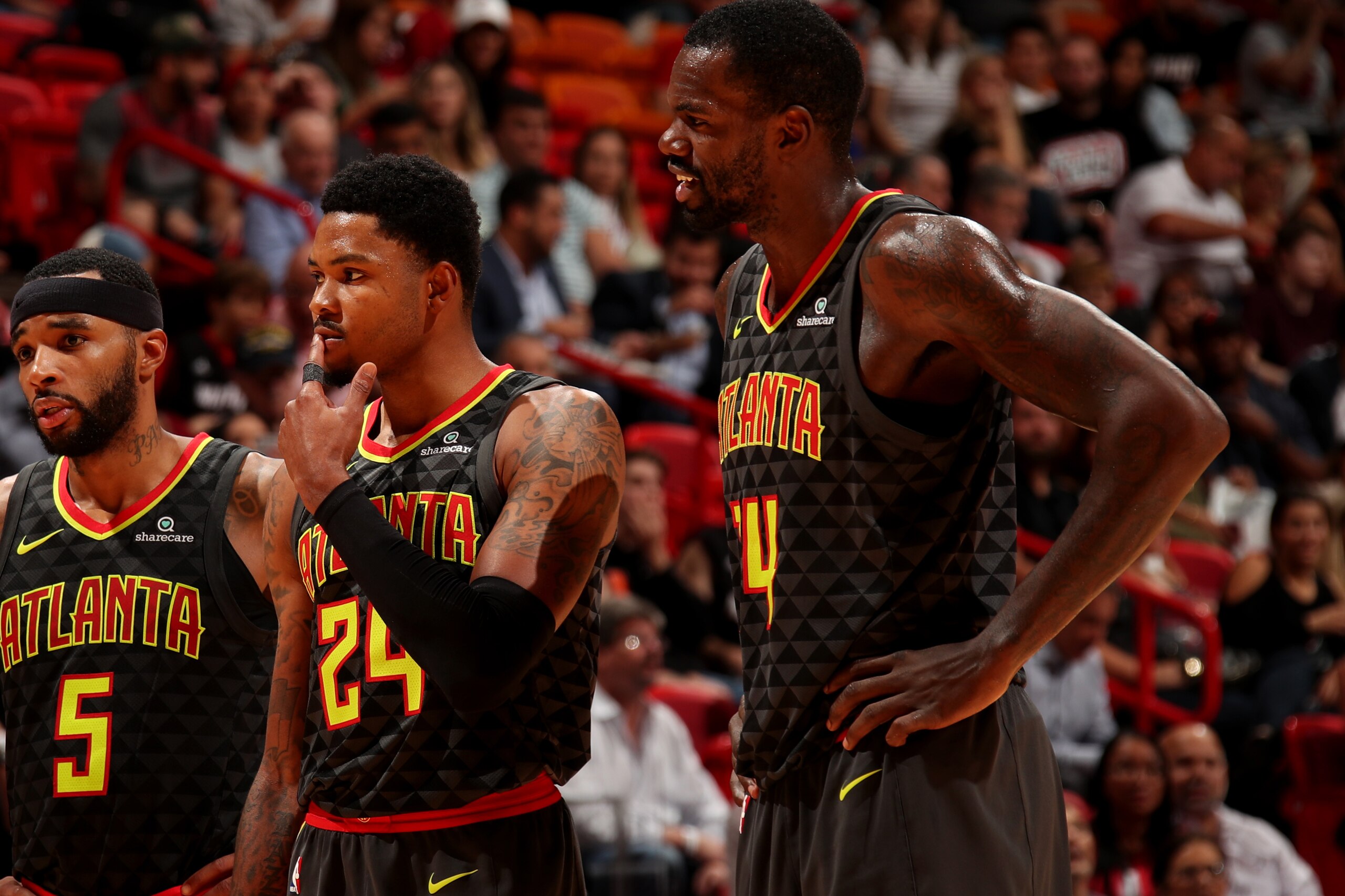 MIAMI, FL - OCTOBER 23: Malcolm Delaney #5 Kent Bazemore #24 and Dewayne Dedmon #14 of the Atlanta Hawks react during the game against the Miami Heat on October 23, 2017 at American Airlines Arena in Miami, Florida. NOTE TO USER: User expressly acknowledg