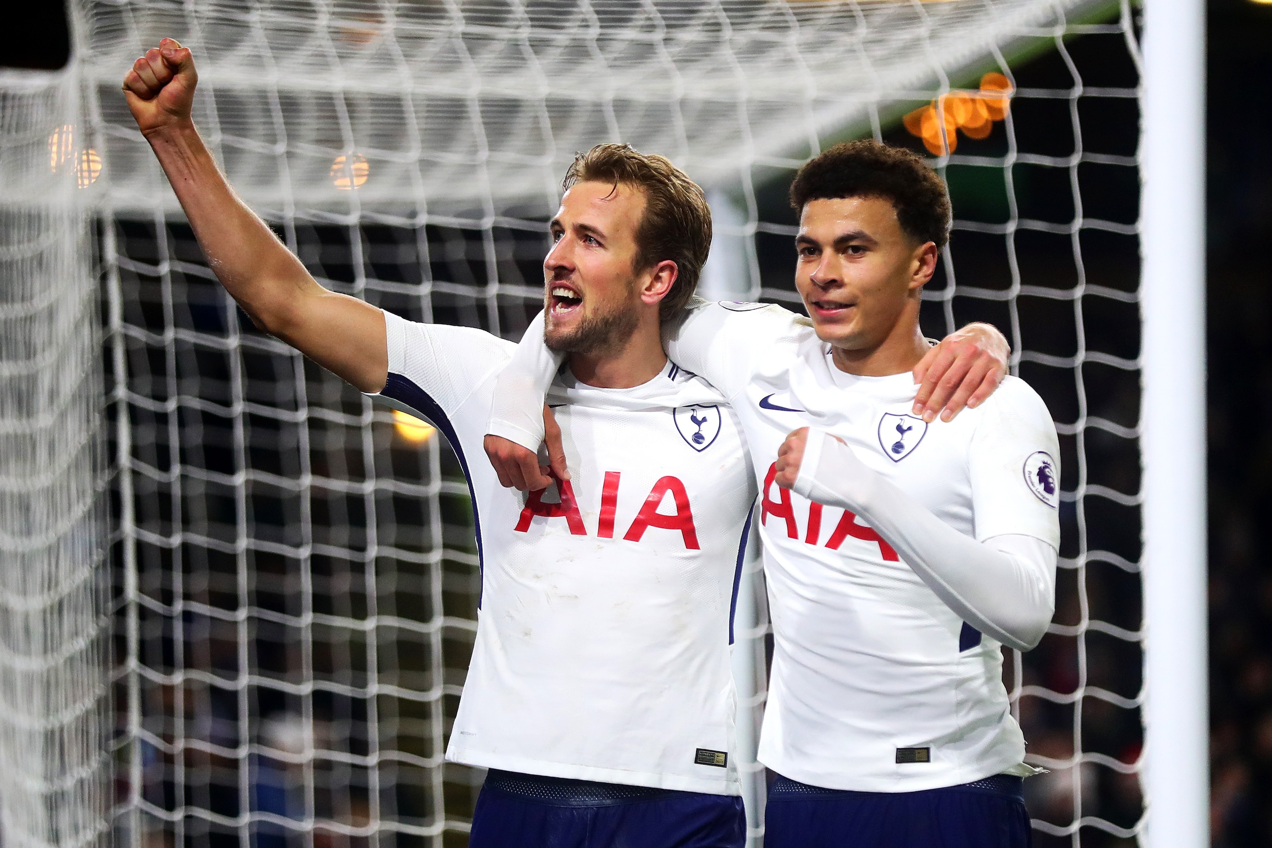 BURNLEY, ENGLAND - DECEMBER 23: Harry Kane of Tottenham Hotspur celebrates scoring his side's second goal with team-mate Dele Alli during the Premier League match between Burnley and Tottenham Hotspur at Turf Moor on December 23, 2017 in Burnley, England.