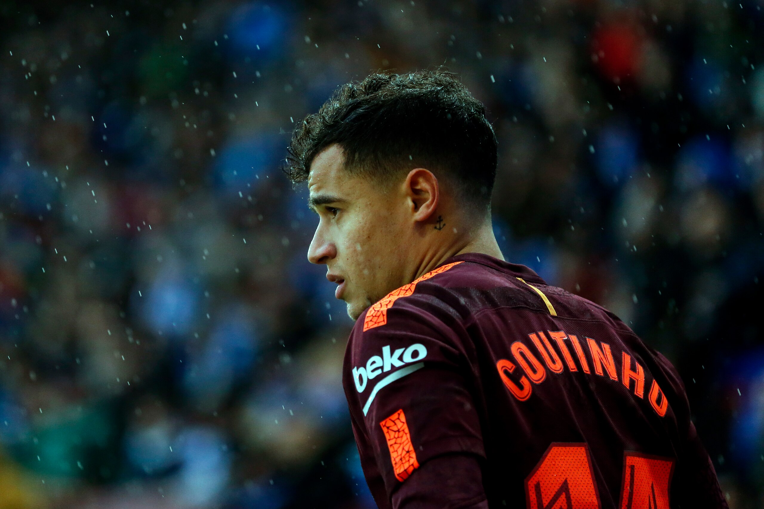 Barcelona's Brazilian midfielder Philippe Coutinho looks on during the Spanish league football match between RCD Espanyol and FC Barcelona at the RCDE Stadium in Cornella de Llobregat on February 4, 2018. / AFP PHOTO / PAU BARRENA        (Photo credit sho