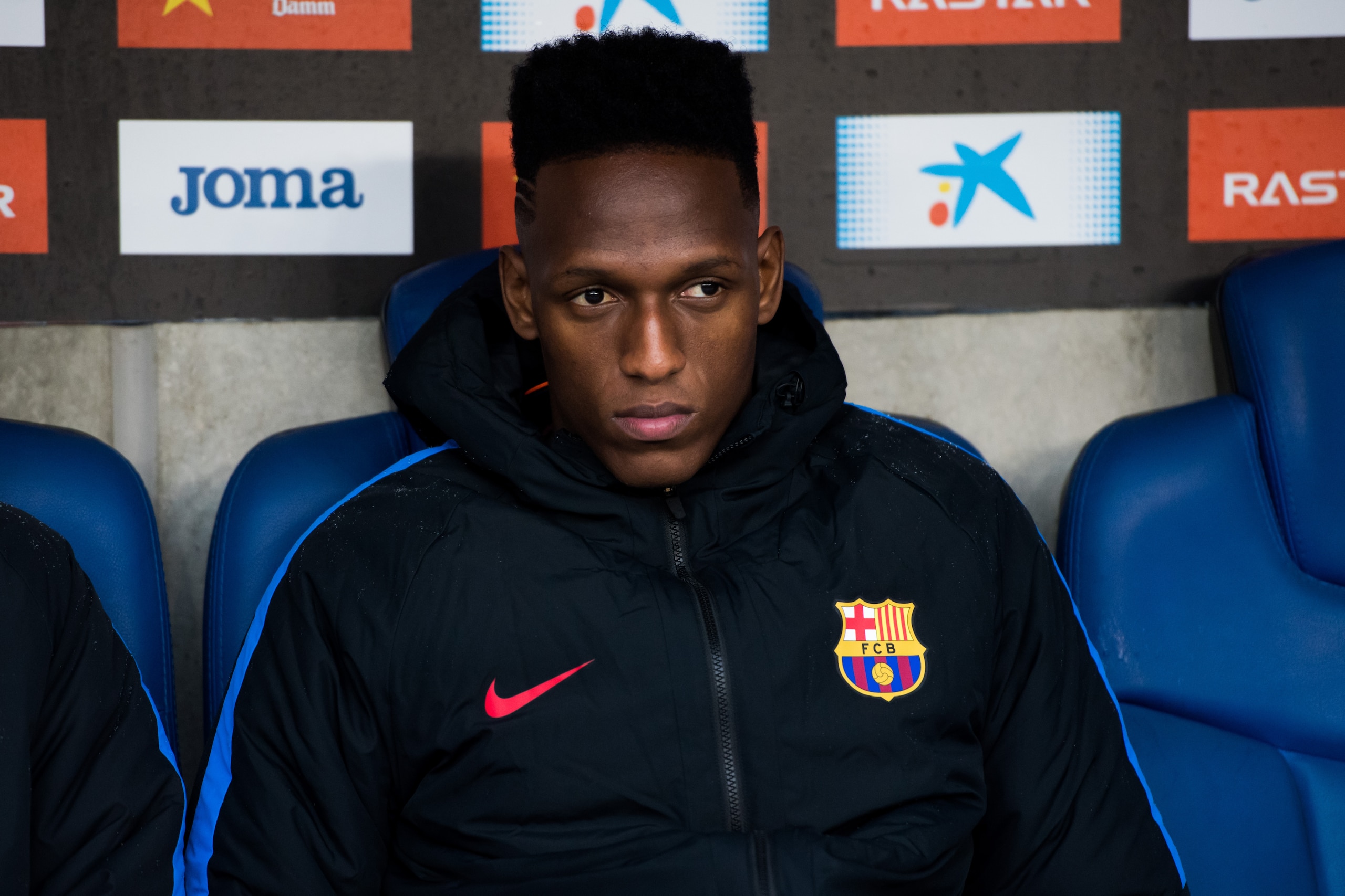 BARCELONA, SPAIN - FEBRUARY 04: Yerry Mina of FC Barcelona looks on from the bench during the La Liga match between Espanyol and Barcelona at RCDE Stadium on February 4, 2018 in Barcelona, Spain. (Photo by Alex Caparros/Getty Images)