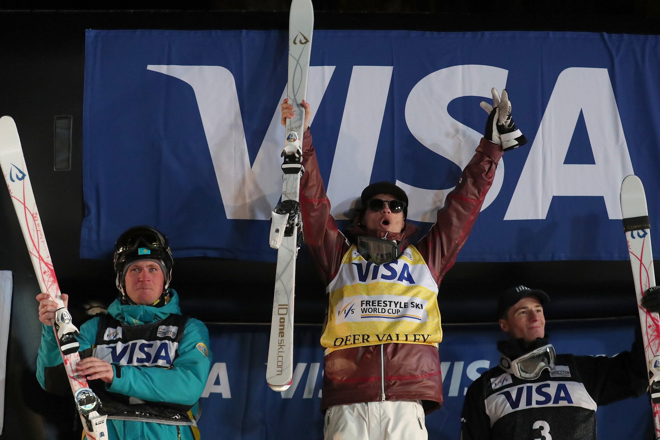 PARK CITY, UT - JANUARY 11: (L-R) Dmitriy Reikherd of Kazakhstan in second place, Mikael Kingsbury of Canada in first place and Matt Graham of Australia in third place celebrate on the podium for the Men's Moguls Finals during the 2018 FIS Freestyle Ski PARK CITY, UT - JANUARY 11: (L-R) Dmitriy Reikherd of Kazakhstan in second place, Mikael Kingsbury of Canada in first place and Matt Graham of Australia in third place celebrate on the podium for the Men's Moguls Finals during the 2018 FIS Freestyle Ski