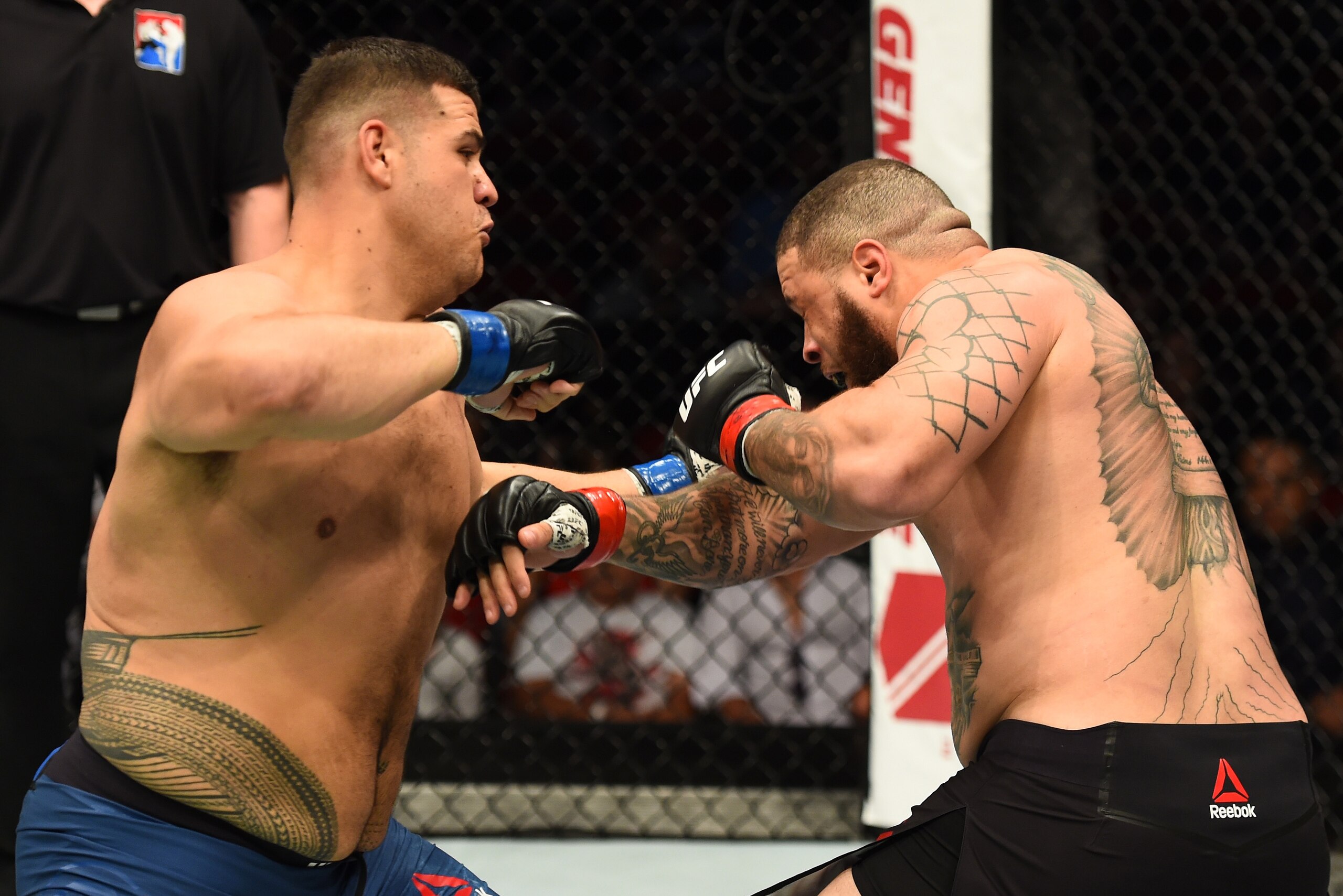 SYDNEY, AUSTRALIA - NOVEMBER 19:  (L-R) Tai Tuivasa punches Rashad Coulter in their heavyweight bout during the UFC Fight Night event inside the Qudos Bank Arena on November 19, 2017 in Sydney, Australia. (Photo by Josh Hedges/Zuffa LLC/Zuffa LLC via Gett