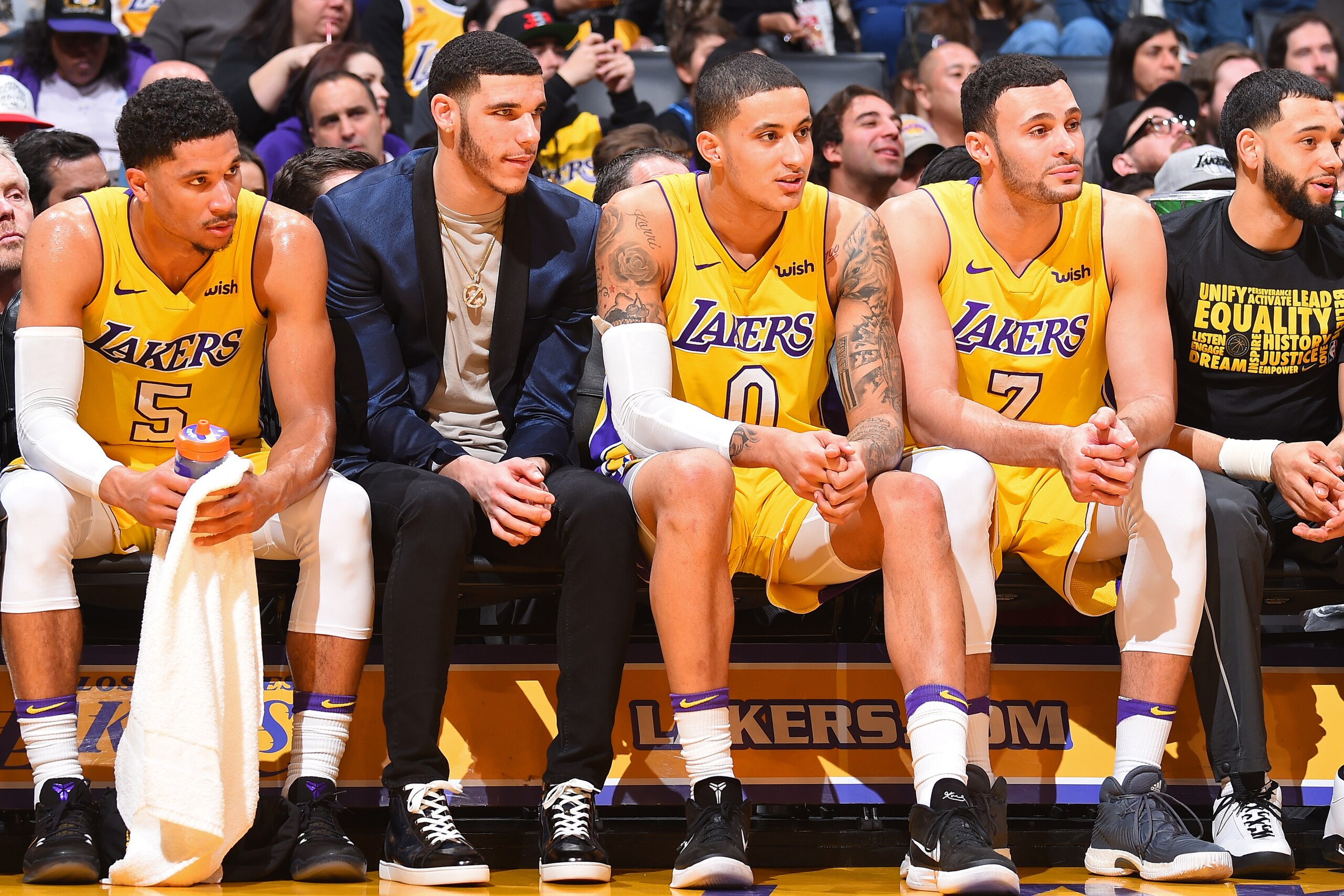 LOS ANGELES, CA - FEBRUARY 6: Josh Hart #5, Lonzo Ball #2, Kyle Kuzma #0 and Larry Nance Jr. #7 of the Los Angeles Lakers sit on the bench during the game against the Phoenix Suns on February 6, 2018 at STAPLES Center in Los Angeles, California. NOTE TO U