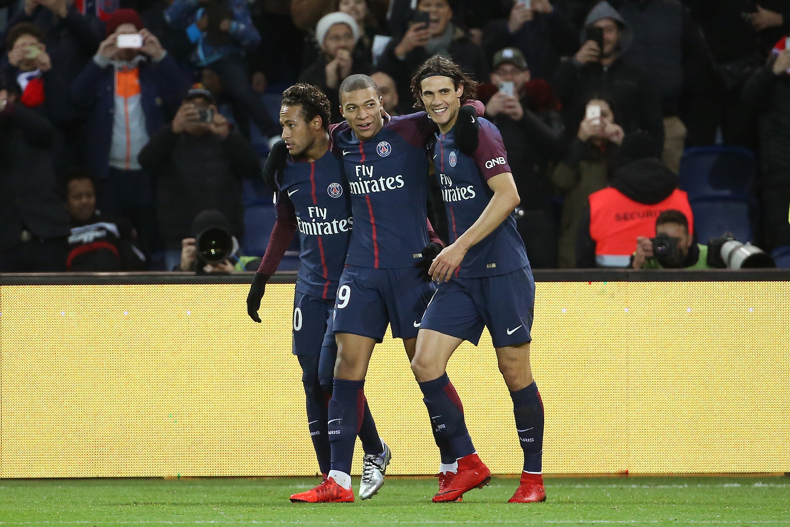 PARIS FRANCE - JANUARY 17: Kylian Mbappe of PSG celebrates his goal between Neymar Jr and Edinson Cavani during the French Ligue 1 match between Paris Saint Germain (PSG) and Dijon FCO at Parc des Princes stadium on January 17, 2018 in Paris, France. (Pho