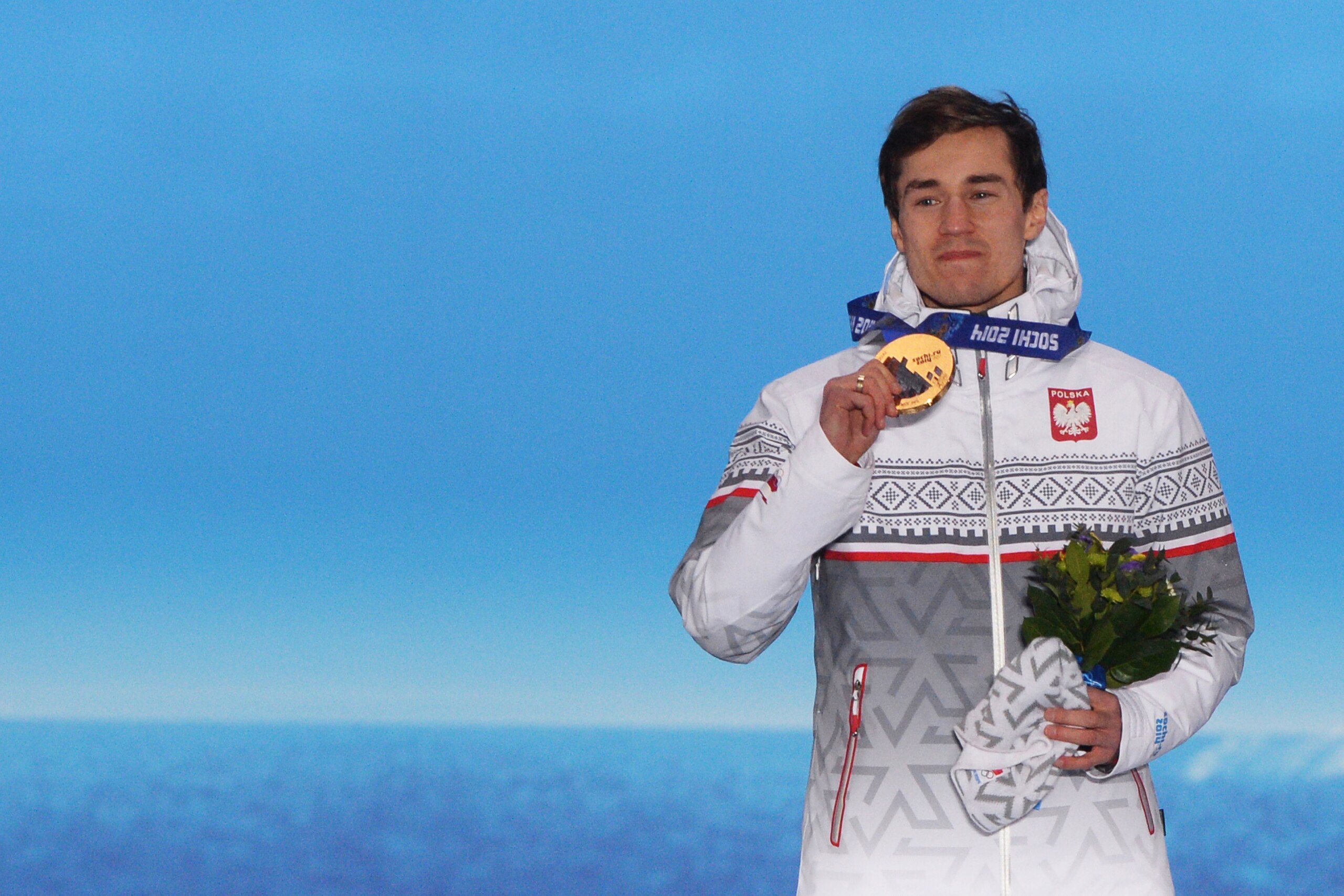 A picture taken with a robotic camera shows Poland's gold medalist Kamil Stoch posing during the Men's Ski Jumping Large Hill Individual Medal Ceremony at the Sochi medals plaza during the Sochi Winter Olympics on February 16, 2014. AFP PHOTO / ANTONIN T A picture taken with a robotic camera shows Poland's gold medalist Kamil Stoch posing during the Men's Ski Jumping Large Hill Individual Medal Ceremony at the Sochi medals plaza during the Sochi Winter Olympics on February 16, 2014. AFP PHOTO / ANTONIN T