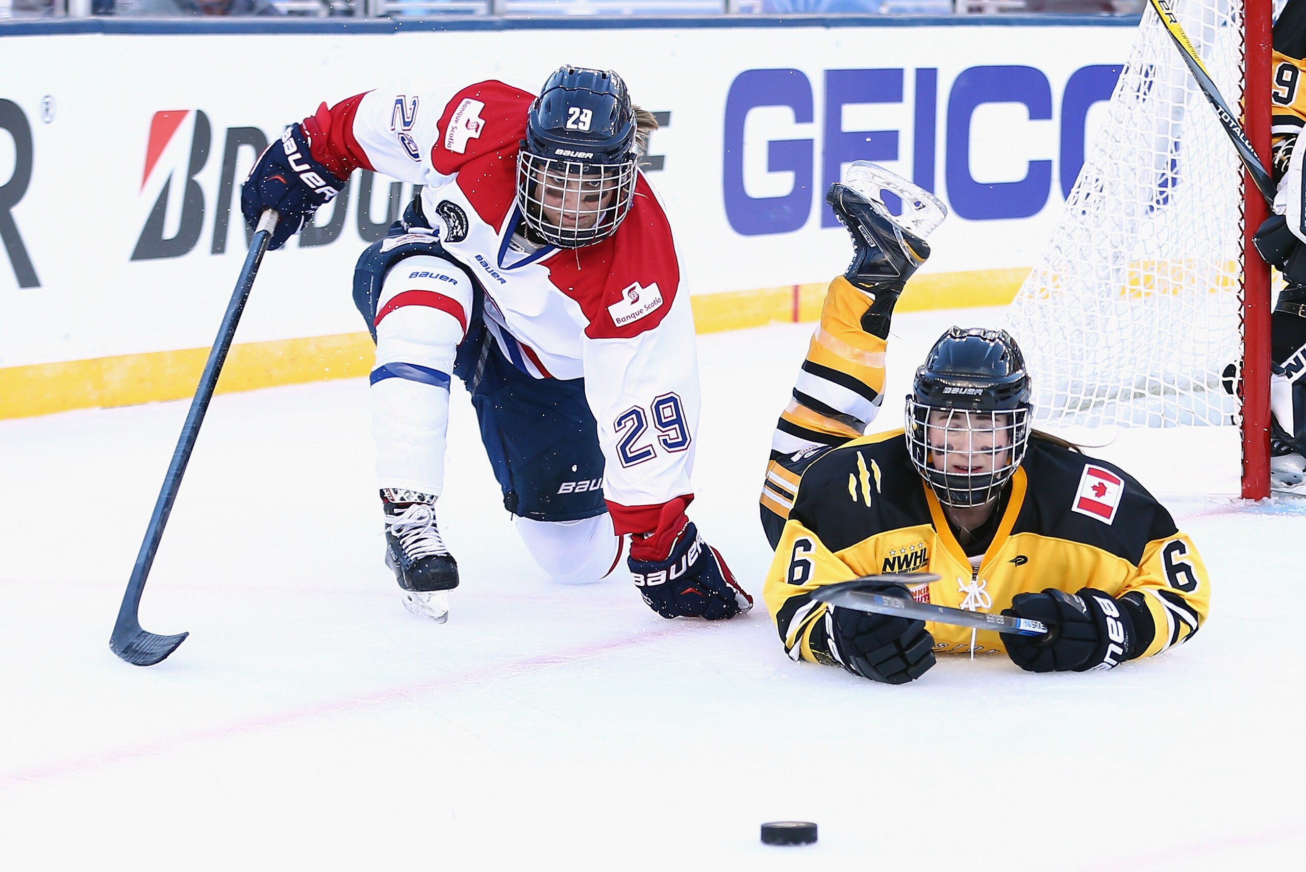 FOXBORO, MA - DECEMBER 31: Shannon Doyle #6 of the Boston Pride (NWHL) battles with Marie-Philip Poulin #29 of the Les Canadiennes (CWHL) during the Outdoor Womens Classic at Gillette Stadium on December 31, 2015 in Foxboro, Massachusetts. (Photo by Mad FOXBORO, MA - DECEMBER 31: Shannon Doyle #6 of the Boston Pride (NWHL) battles with Marie-Philip Poulin #29 of the Les Canadiennes (CWHL) during the Outdoor Womens Classic at Gillette Stadium on December 31, 2015 in Foxboro, Massachusetts. (Photo by Mad