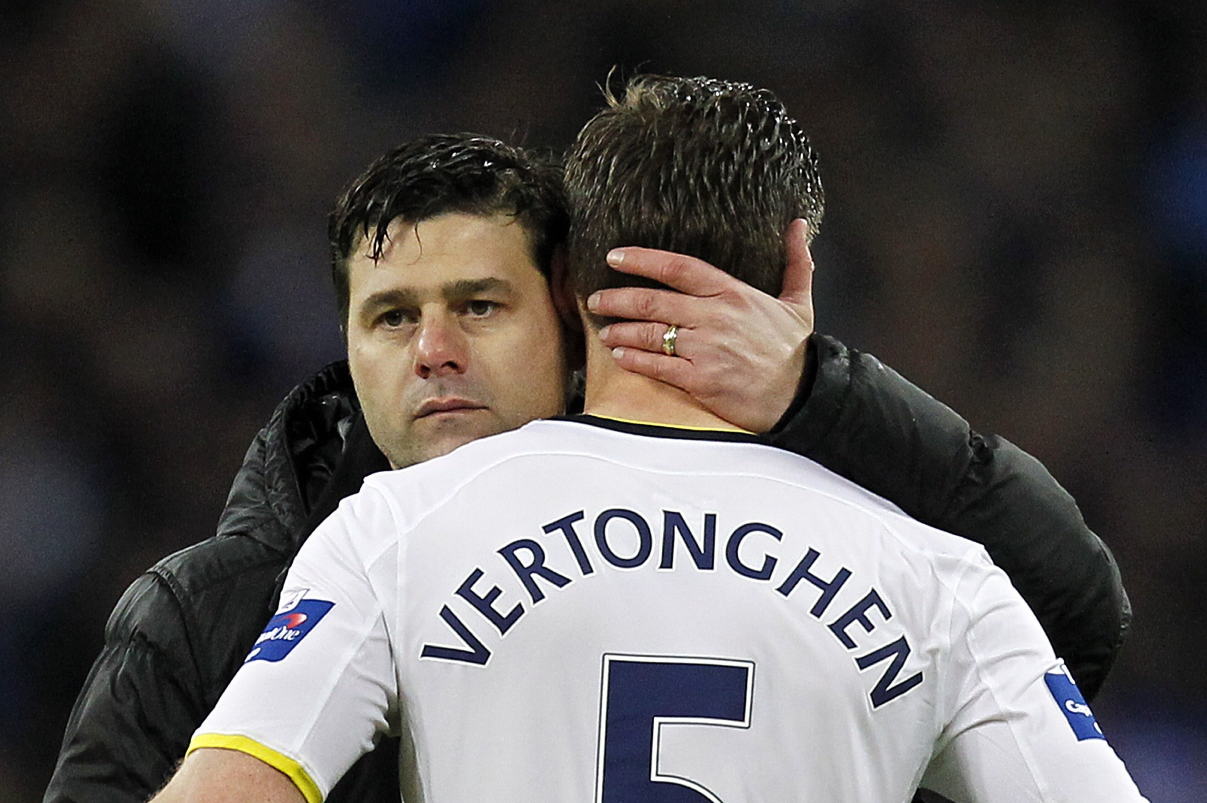 Tottenham Hotspur's Argentinian Head Coach Mauricio Pochettino consoles Tottenham Hotspur's Belgian defender Jan Vertonghen at the final whistle in the English League Cup Final football match between Chelsea and Tottenham Hotspur at Wembley Stadium in nor