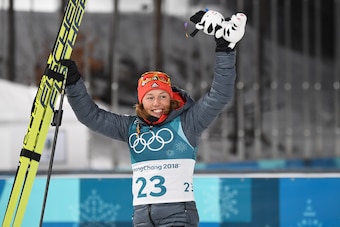 Germany's Laura Dahlmeier celebrates after wining gold in the women's 7,5 km sprint biathlon event during the Pyeongchang 2018 Winter Olympic Games on February 10, 2018, in Pyeongchang. / AFP PHOTO / FRANCK FIFE        (Photo credit should read FRANCK FIF