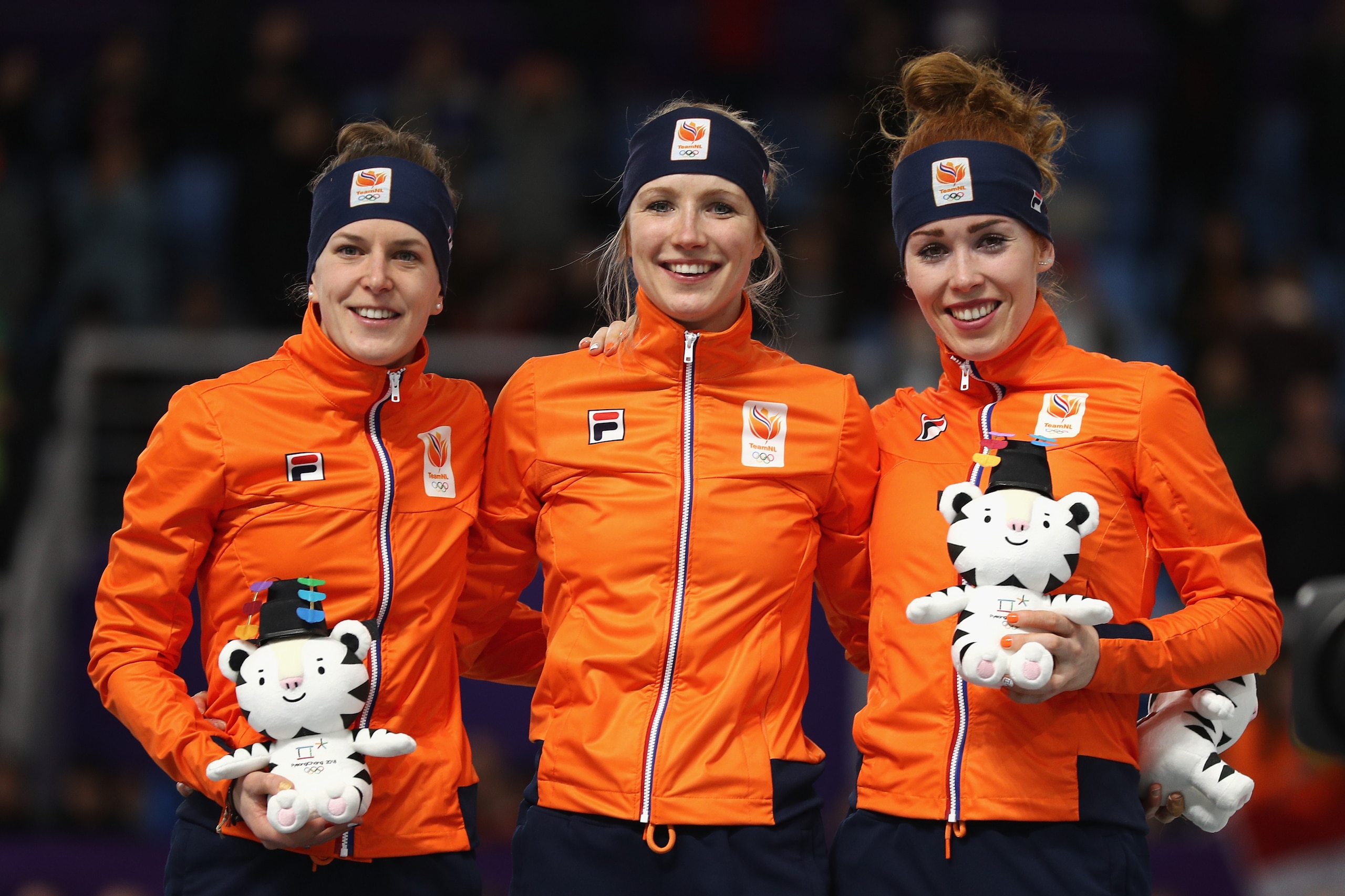GANGNEUNG, SOUTH KOREA - FEBRUARY 10:  (L-R) Silver medalist Ireen Wust of the Netherlands, gold medalist Carlijn Achtereekte of the Netherlands and bronze medalist Antoinette De Jong of the Netherlands celebrate during the victory ceremony after the Wome