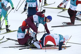 PYEONGCHANG-GUN, SOUTH KOREA - FEBRUARY 11:  Denis Spitsov (L), Olympic Athlete from Russia, Andrey Larkov (C), Olympic Athlete from Russia and Simen Hegstad Krueger of Norway crash during the Men's 15km and 15km Skiathlon Cross-Country Skiing on day two 