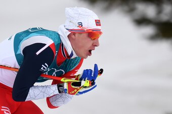 Norway's Simen Hegstad Krueger sprints to win the men's 15km + 15km cross-country skiathlon at the Alpensia cross country ski centre during the Pyeongchang 2018 Winter Olympic Games on February 11, 2018 in Pyeongchang.  / AFP PHOTO / Christof STACHE      