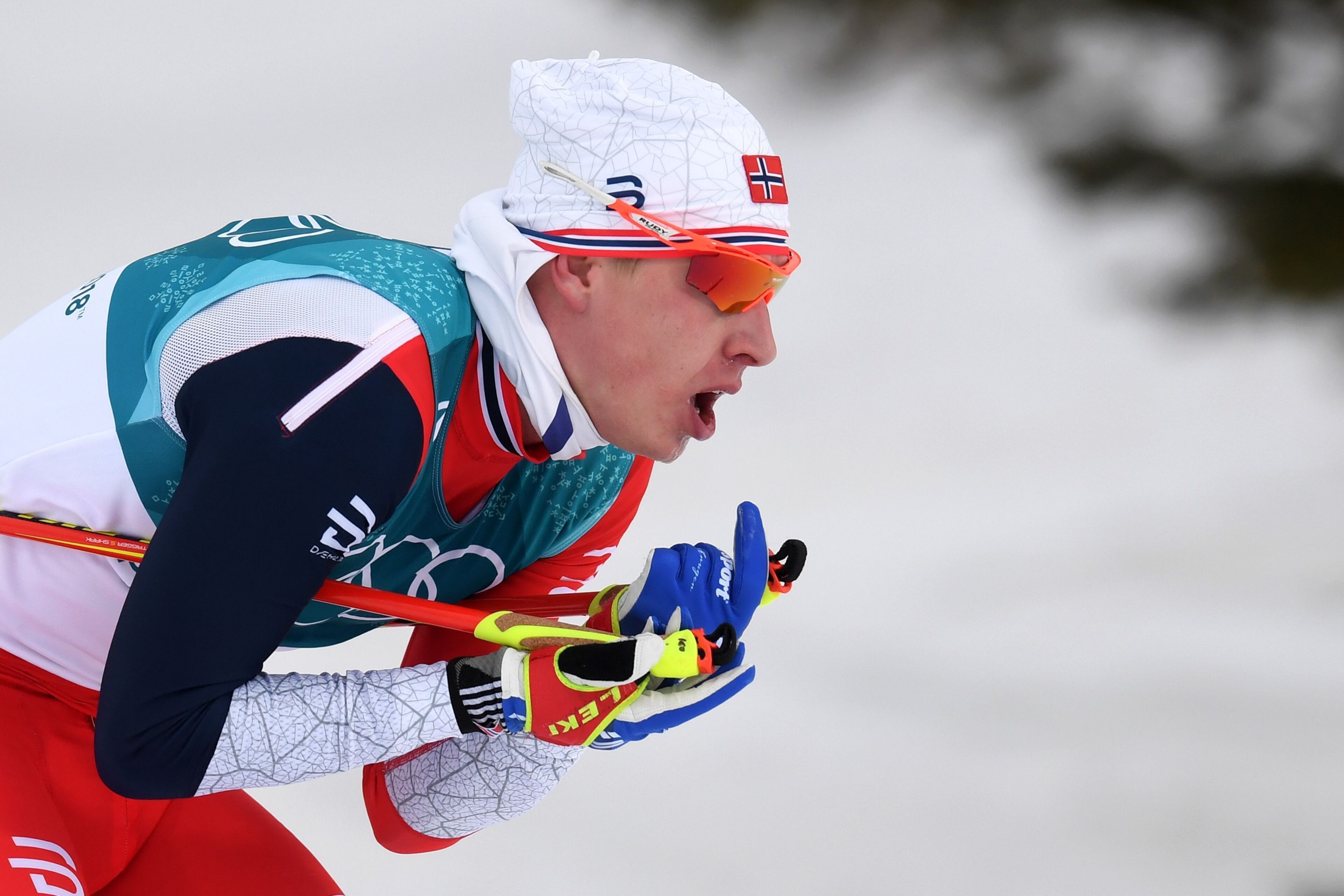 Norway's Simen Hegstad Krueger sprints to win the men's 15km + 15km cross-country skiathlon at the Alpensia cross country ski centre during the Pyeongchang 2018 Winter Olympic Games on February 11, 2018 in Pyeongchang.  / AFP PHOTO / Christof STACHE      