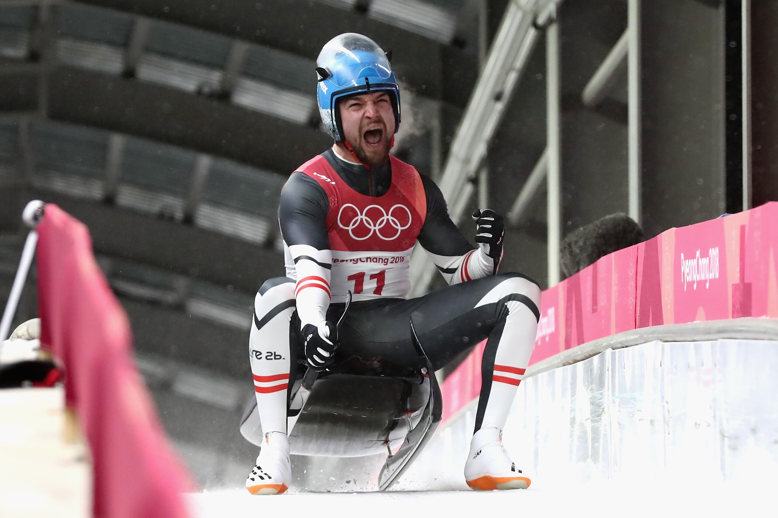 PYEONGCHANG-GUN, SOUTH KOREA - FEBRUARY 11:  David Gleirscher of Austria celebrates winning the gold following run 4 during the Luge Men's Singles on day two of the PyeongChang 2018 Winter Olympic Games at Olympic Sliding Centre on February 11, 2018 in Py