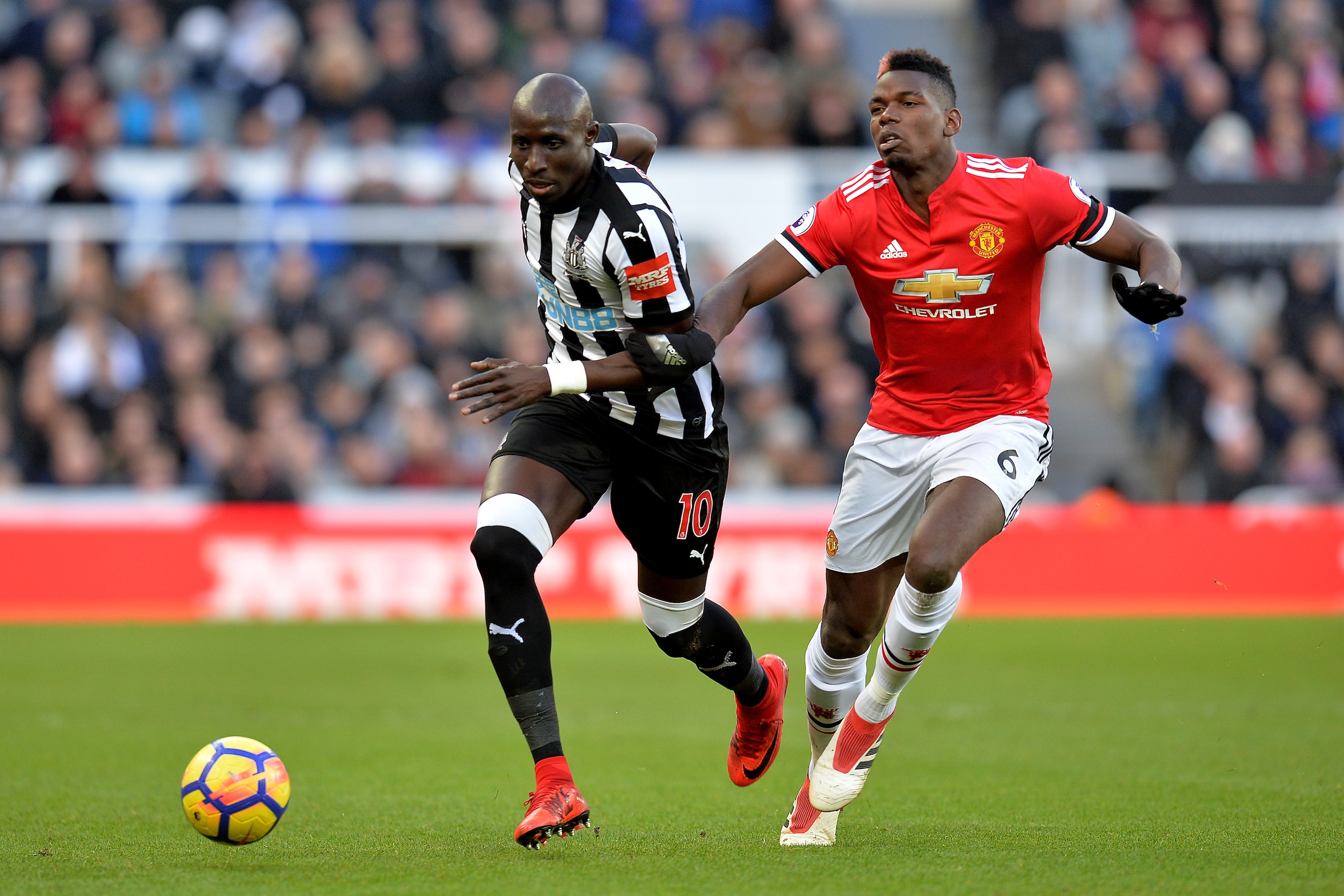 NEWCASTLE UPON TYNE, ENGLAND - FEBRUARY 11: Mohamed Diame of Newcastle United is challenged by Paul Pogba of Manchester United during the Premier League match between Newcastle United and Manchester United at St. James Park on February 11, 2018 in Newcas NEWCASTLE UPON TYNE, ENGLAND - FEBRUARY 11: Mohamed Diame of Newcastle United is challenged by Paul Pogba of Manchester United during the Premier League match between Newcastle United and Manchester United at St. James Park on February 11, 2018 in Newcas