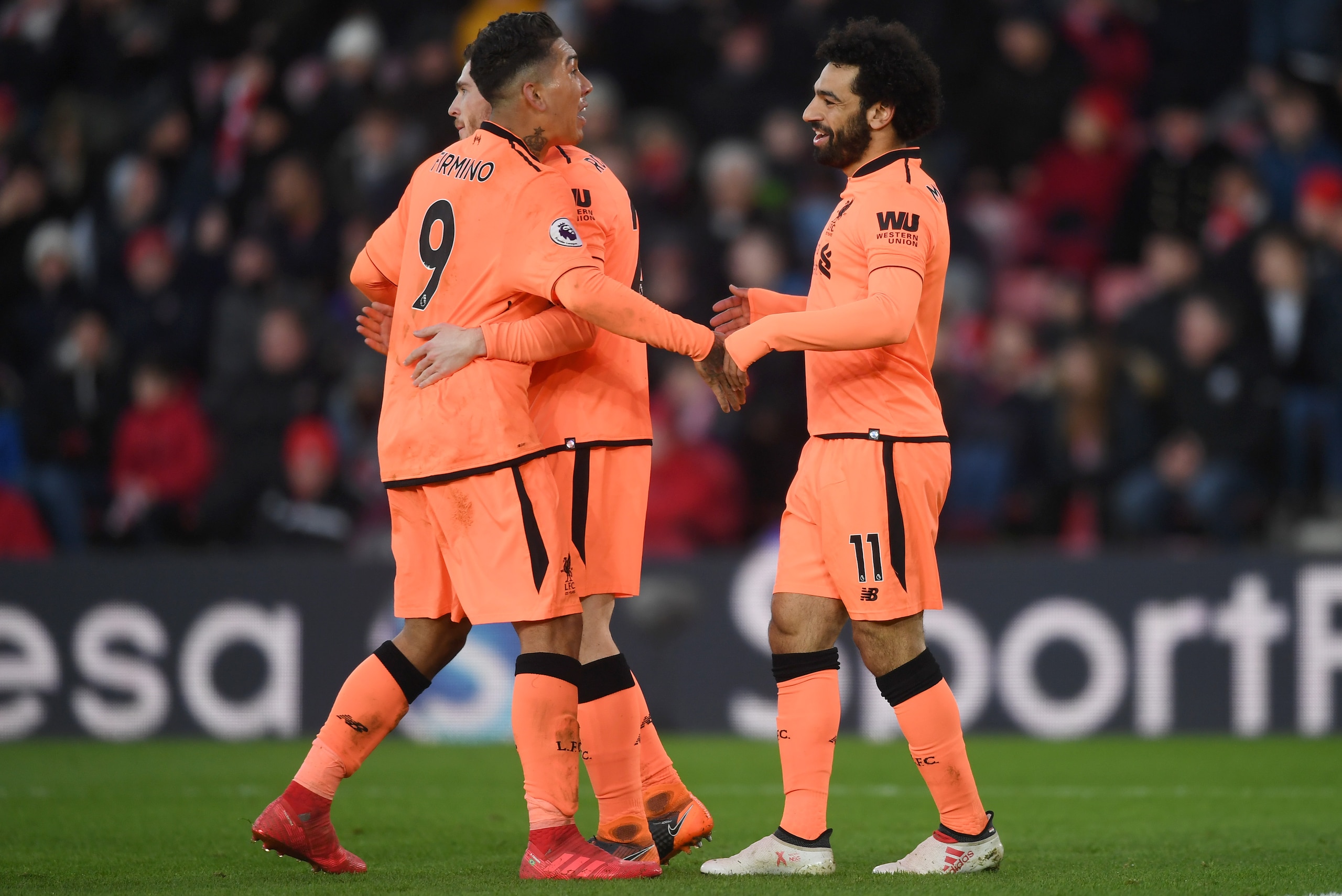 SOUTHAMPTON, ENGLAND - FEBRUARY 11: Mohamed Salah of Liverpool celebrates after scoring his sides second goal with Roberto Firmino of Liverpool and Andy Robertson of Liverpool during the Premier League match between Southampton and Liverpool at St Mary's SOUTHAMPTON, ENGLAND - FEBRUARY 11: Mohamed Salah of Liverpool celebrates after scoring his sides second goal with Roberto Firmino of Liverpool and Andy Robertson of Liverpool during the Premier League match between Southampton and Liverpool at St Mary's