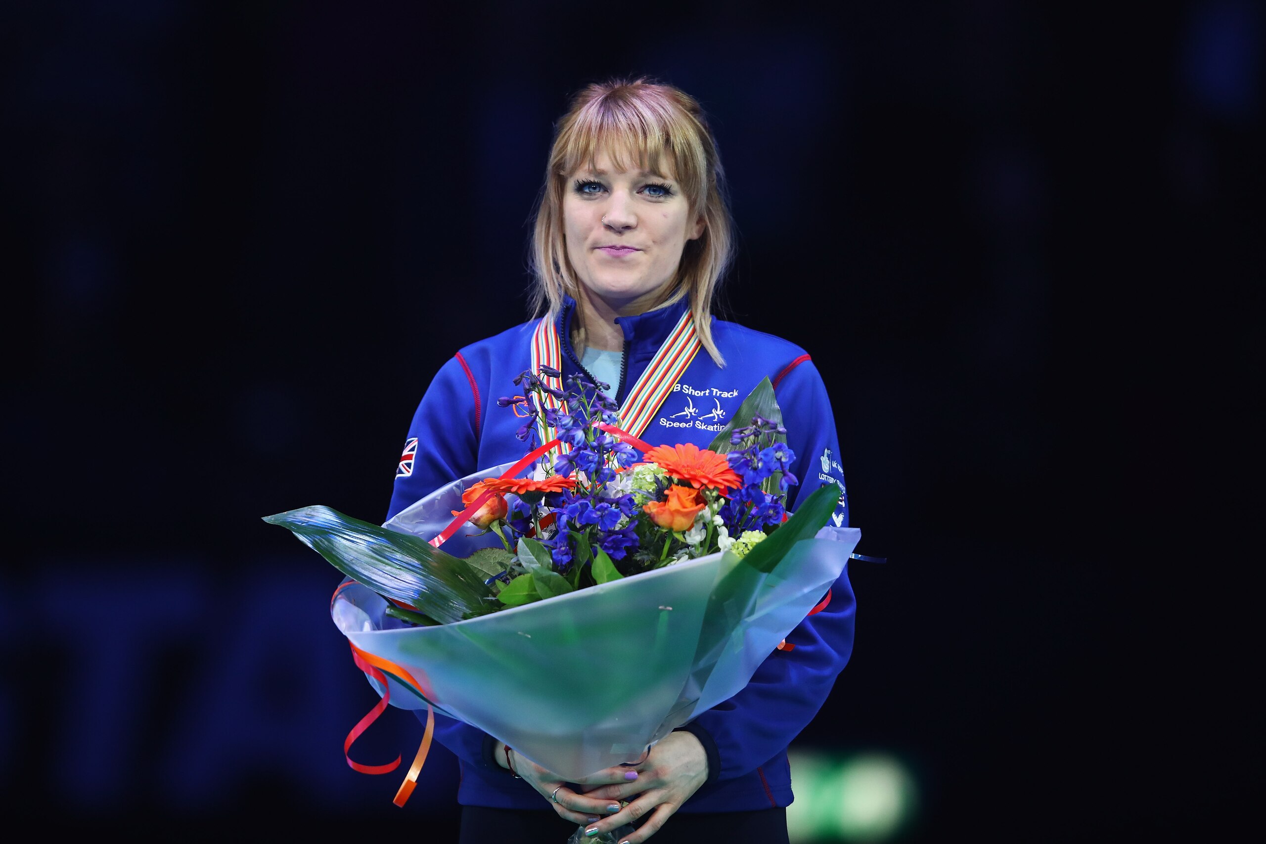ROTTERDAM, NETHERLANDS - MARCH 12:  Elise Christie of Great Britain with the gold medal celebrates on the podium after the Ladies overall ceremony during day two of ISU World Short Track Championships at Rotterdam Ahoy Arena on March 12, 2017 in Rotterdam