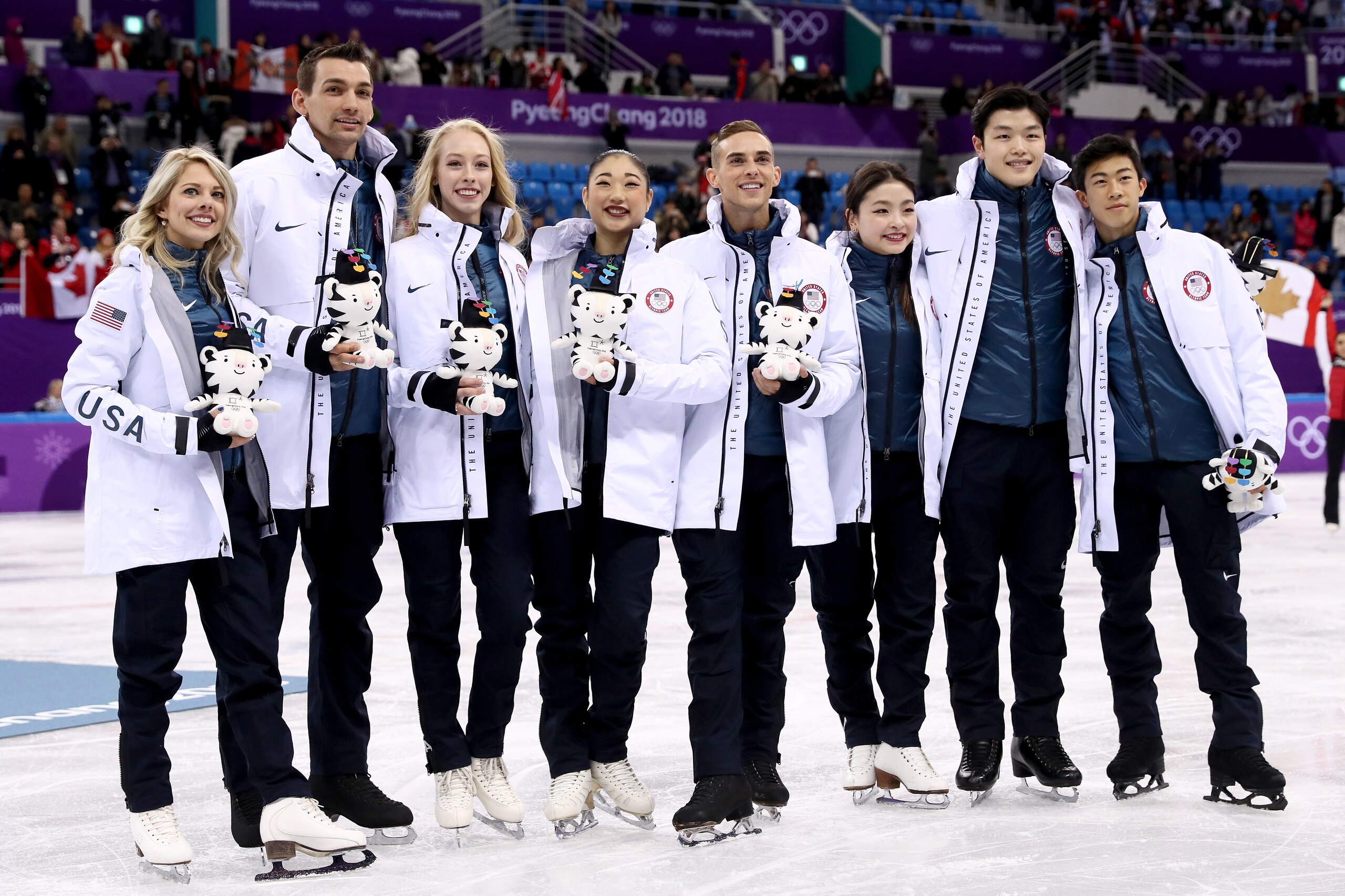 GANGNEUNG, SOUTH KOREA - FEBRUARY 12: Bronze medalists Nathan Chen, Adam Rippon, Mirai Nagasu, Bradie Tennell, Alexa Scimeca Knierim, Chris Knierim, Alex Shibutani, Maia Shibutani and Alex Shibutani of the United States celebrate during the victory ceremo