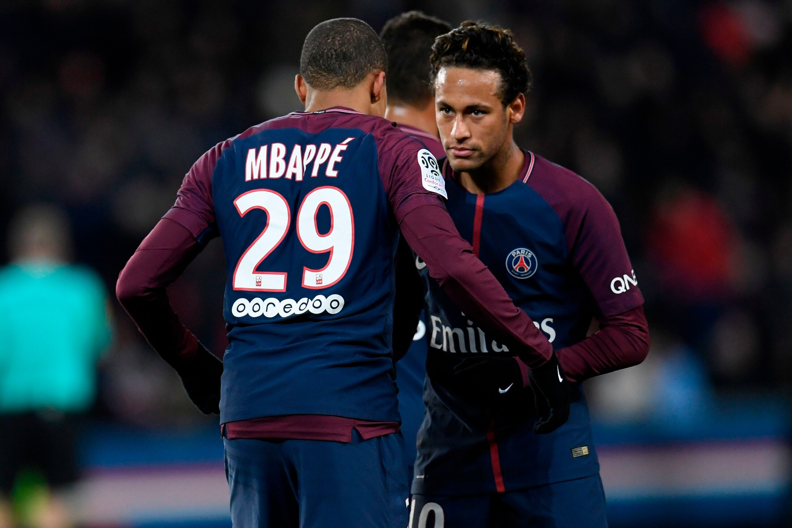 Paris Saint-Germain's French forward Kylian Mbappe (L) celebrates with Paris Saint-Germain's Brazilian forward Neymar after scoring his team's seventh goal during the French L1 football match between Paris Saint-German and Dijon on January 17, 2018 at the Paris Saint-Germain's French forward Kylian Mbappe (L) celebrates with Paris Saint-Germain's Brazilian forward Neymar after scoring his team's seventh goal during the French L1 football match between Paris Saint-German and Dijon on January 17, 2018 at the