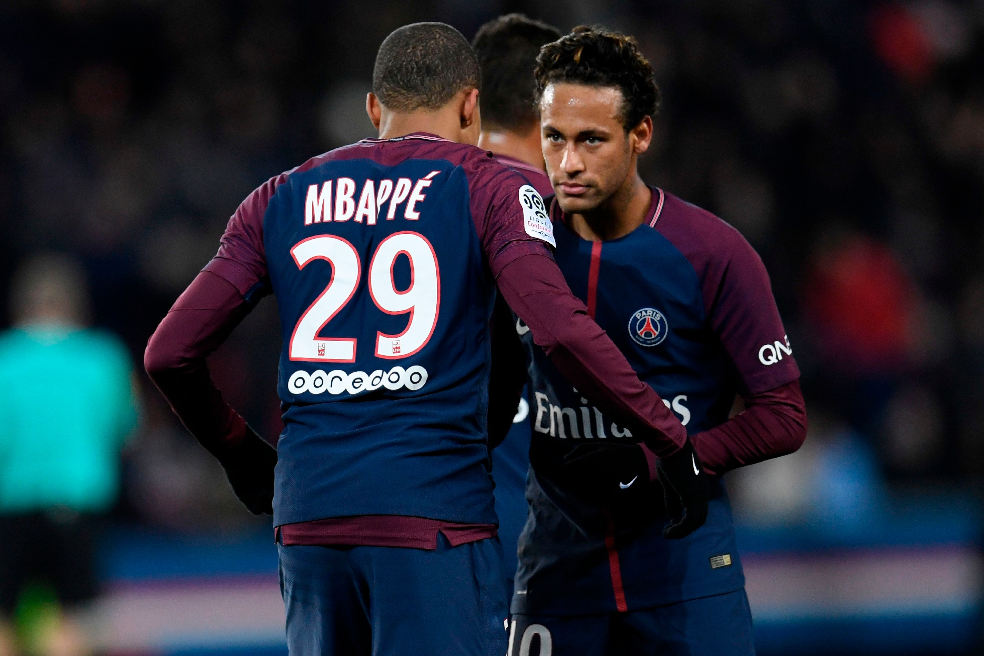 Paris Saint-Germain's French forward Kylian Mbappe (L) celebrates with Paris Saint-Germain's Brazilian forward Neymar after scoring his team's seventh goal during the French L1 football match between Paris Saint-German and Dijon on January 17, 2018 at the