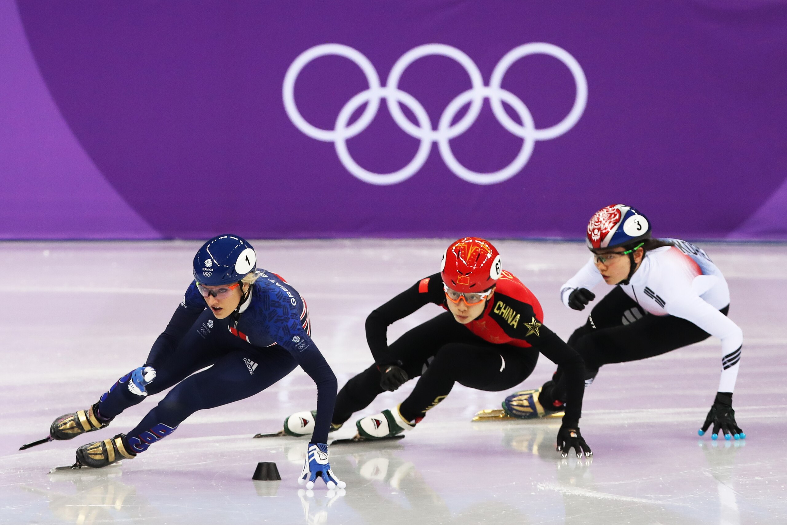 GANGNEUNG, SOUTH KOREA - FEBRUARY 10: Elise Christie of Great Britain is seen racing Chunyu Qu of China during the Women's 500m heats of the Short Track Speed Skating on day one of the PyeongChang 2018 Winter Olympic Games at Gangneung Ice Arena on Februa