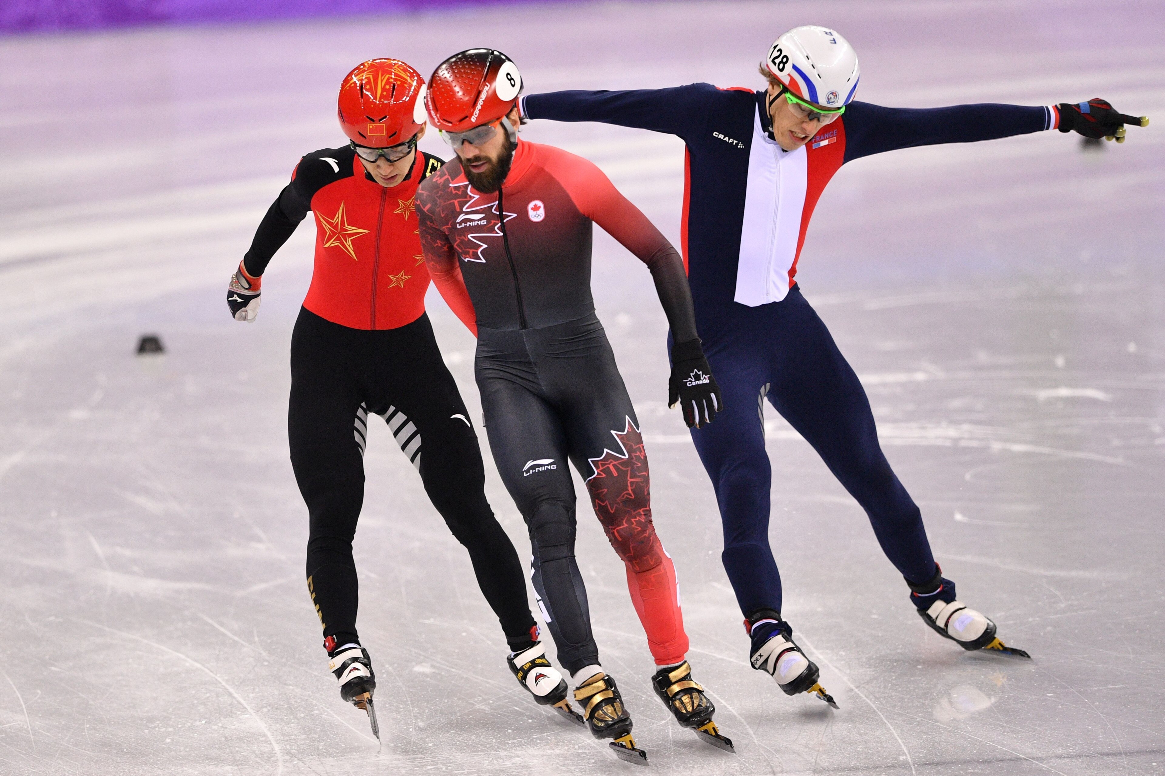 (L-R) China's Wu Dajing, Canada's Charles Hamelin and France's Sebastien Lepape compete in the men's 1,000m short track speed skating heat event during the Pyeongchang 2018 Winter Olympic Games, at the Gangneung Ice Arena in Gangneung on February 13, 2018 (L-R) China's Wu Dajing, Canada's Charles Hamelin and France's Sebastien Lepape compete in the men's 1,000m short track speed skating heat event during the Pyeongchang 2018 Winter Olympic Games, at the Gangneung Ice Arena in Gangneung on February 13, 2018